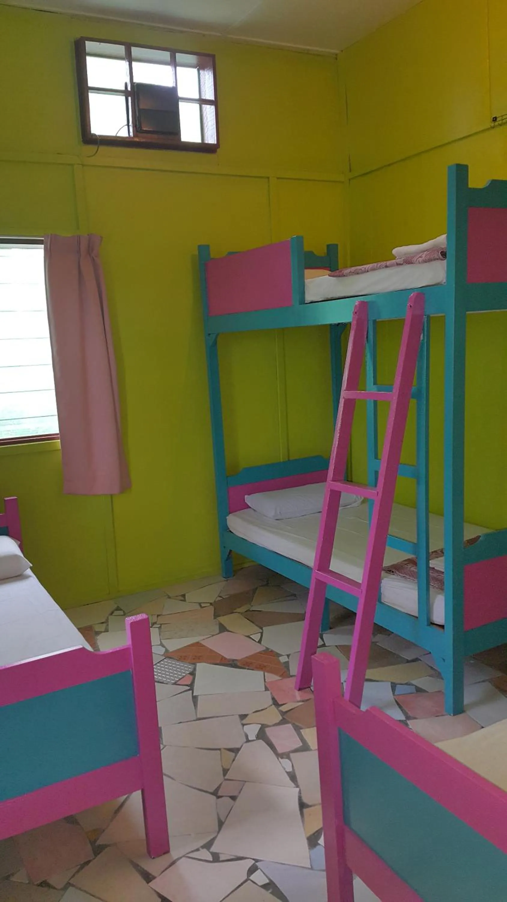 Bed in Sepilok Jungle Resort