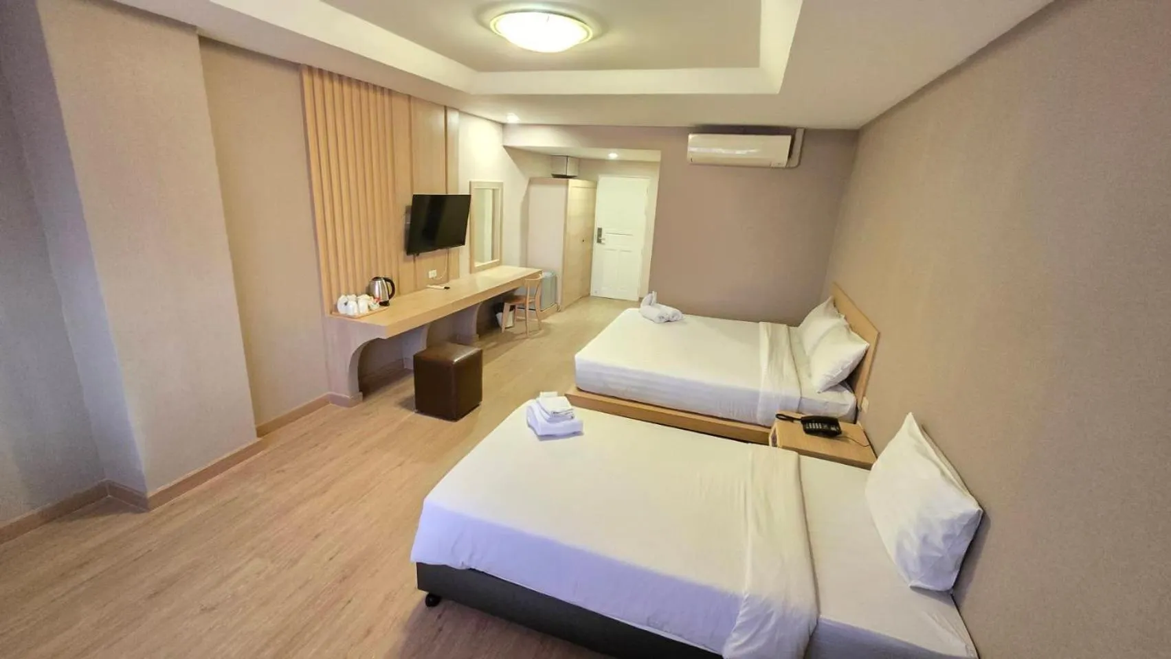 Bed in Grand Tara Garden Thai Hotel