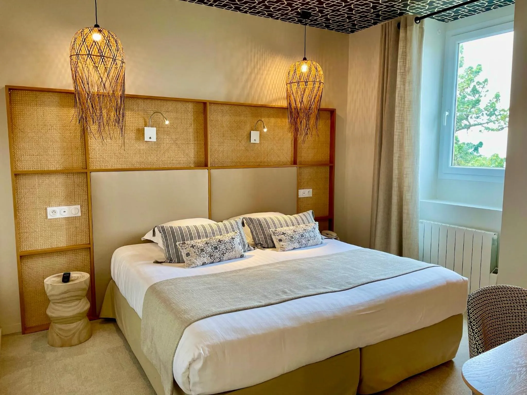 Bed in Hôtel Les Costans, The Originals Relais