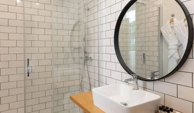 Shower in Hôtel Les Costans, The Originals Relais