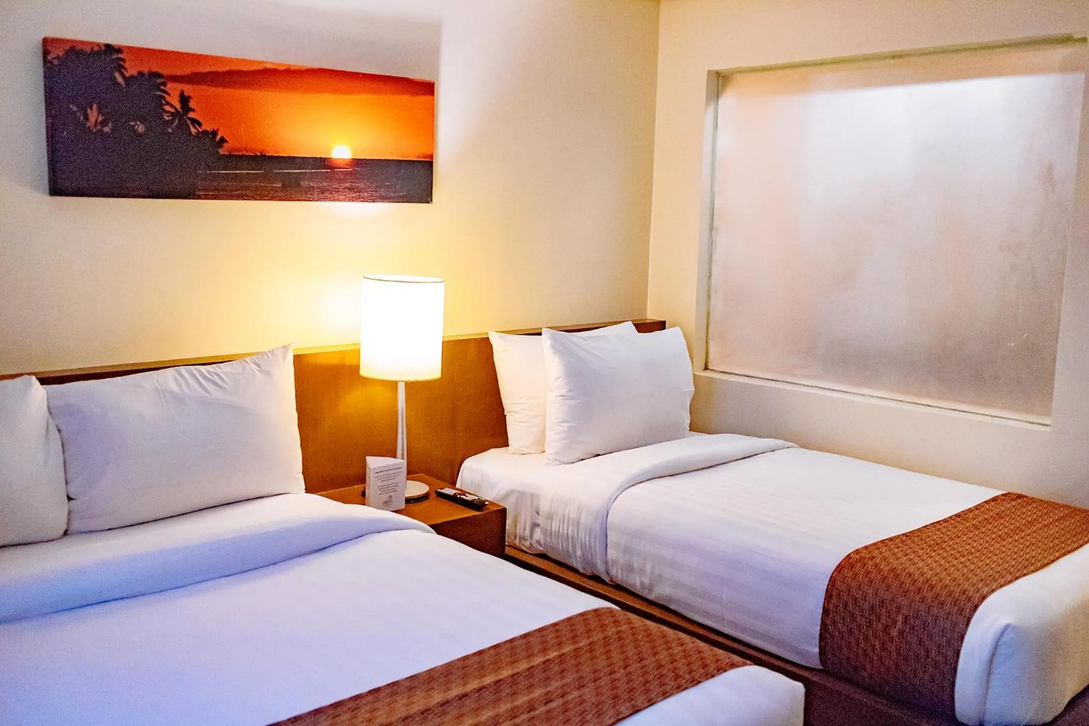 Bed in Crown Regency Beach Resort