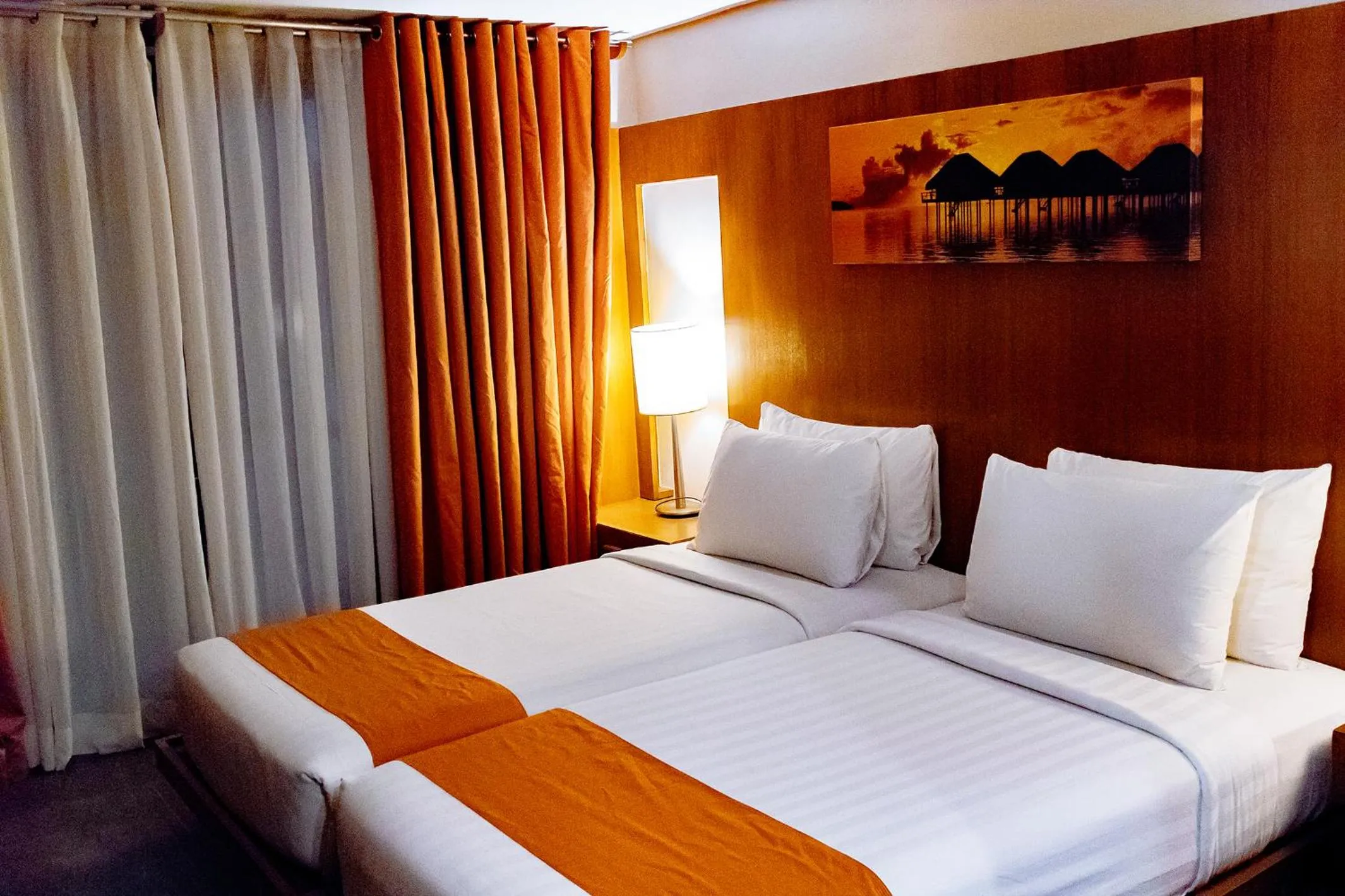 Bed in Crown Regency Beach Resort