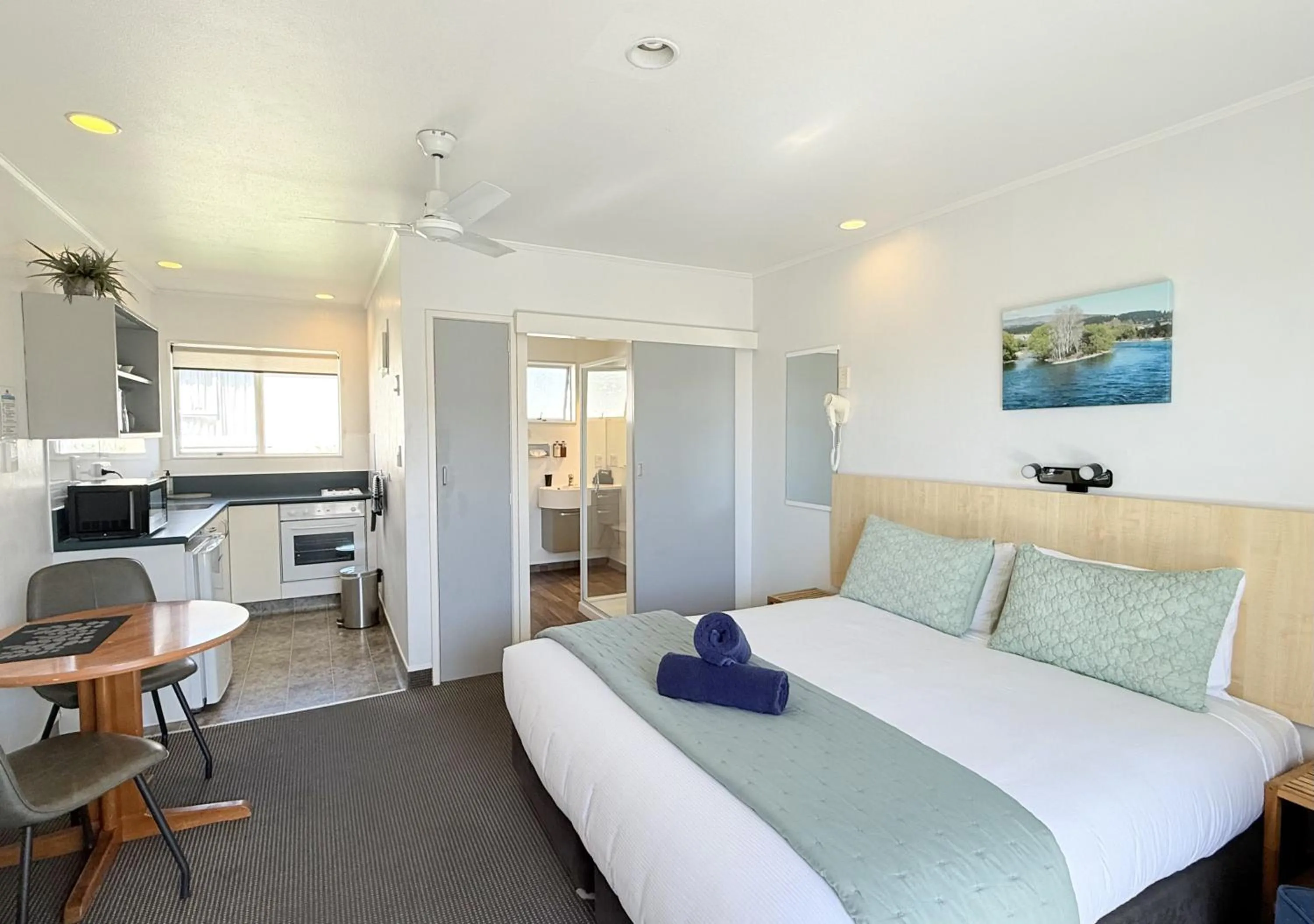 Bed in ASURE Fountain Resort Motel