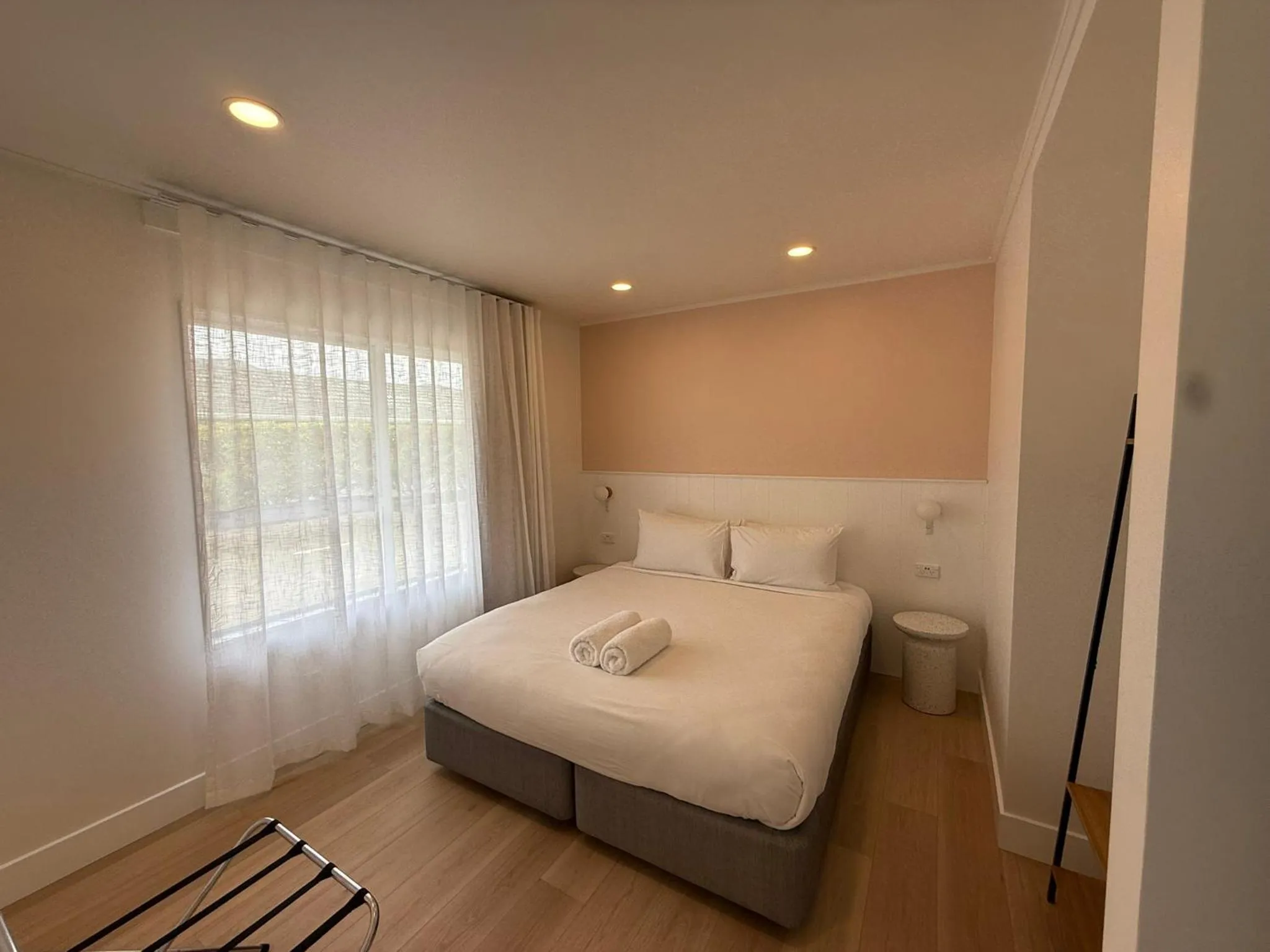 Bed in ASURE Fountain Resort Motel