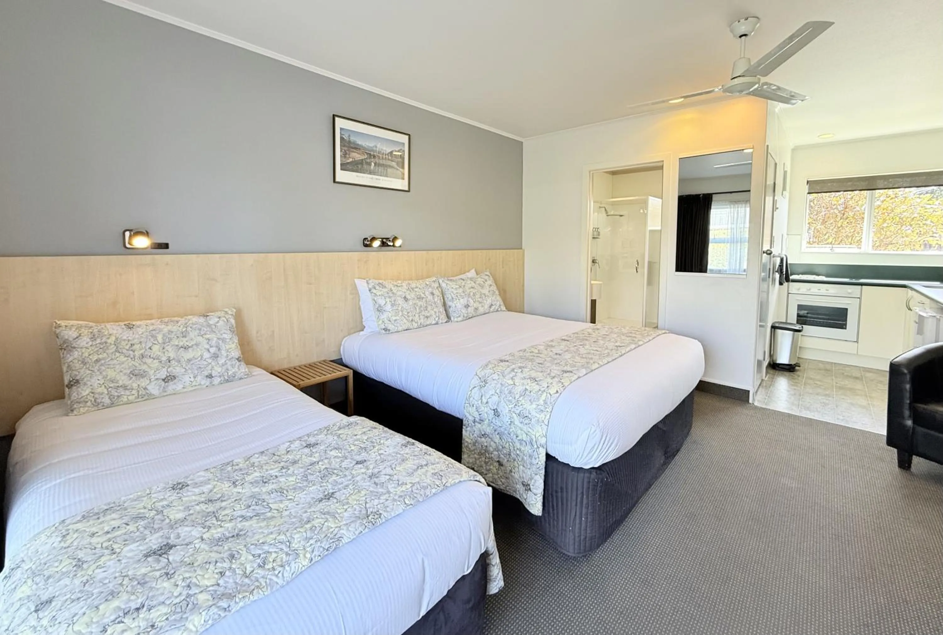 Bed in ASURE Fountain Resort Motel