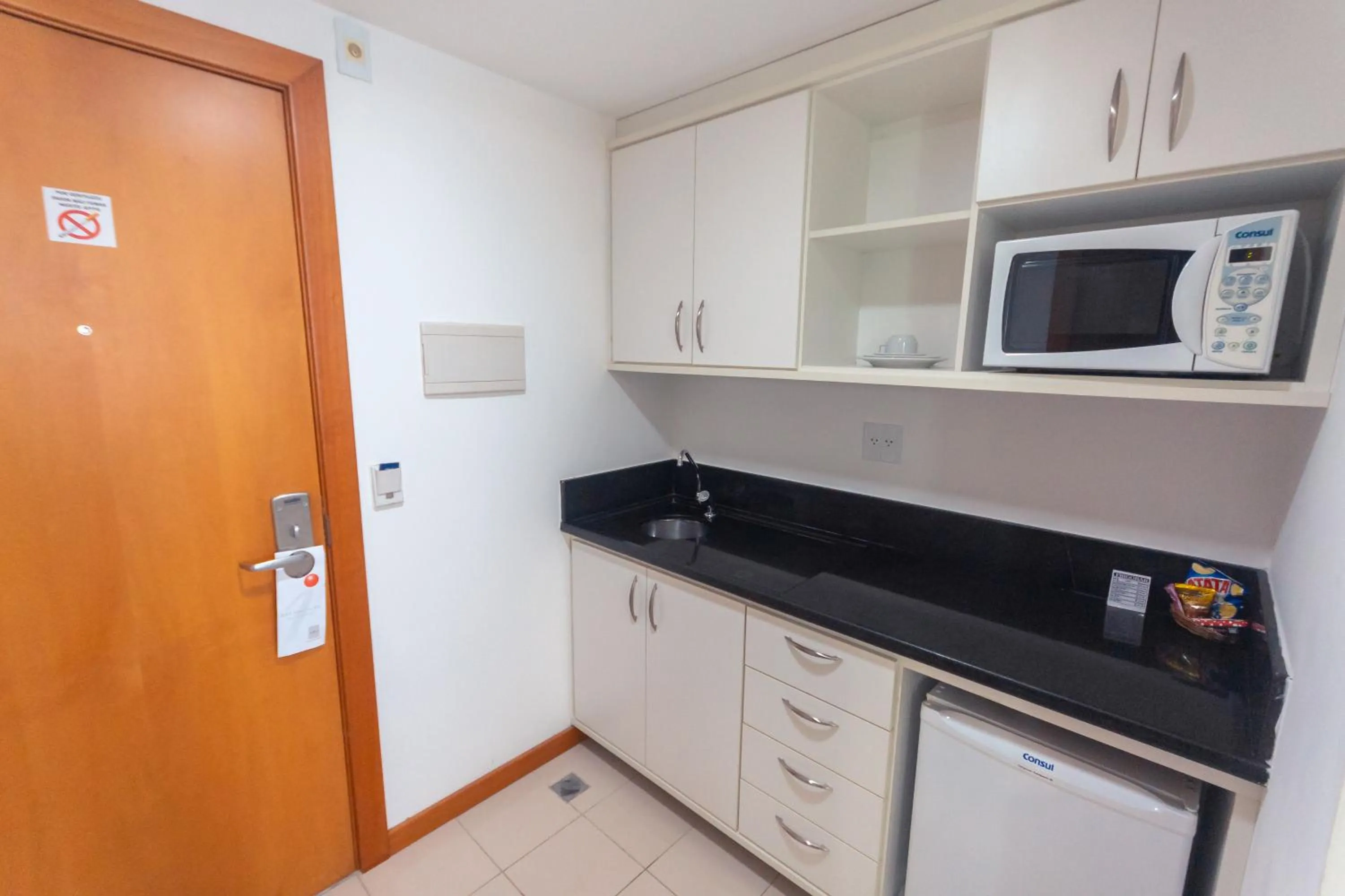 Kitchen or kitchenette in Iguatemi Business & Flat by Avectur