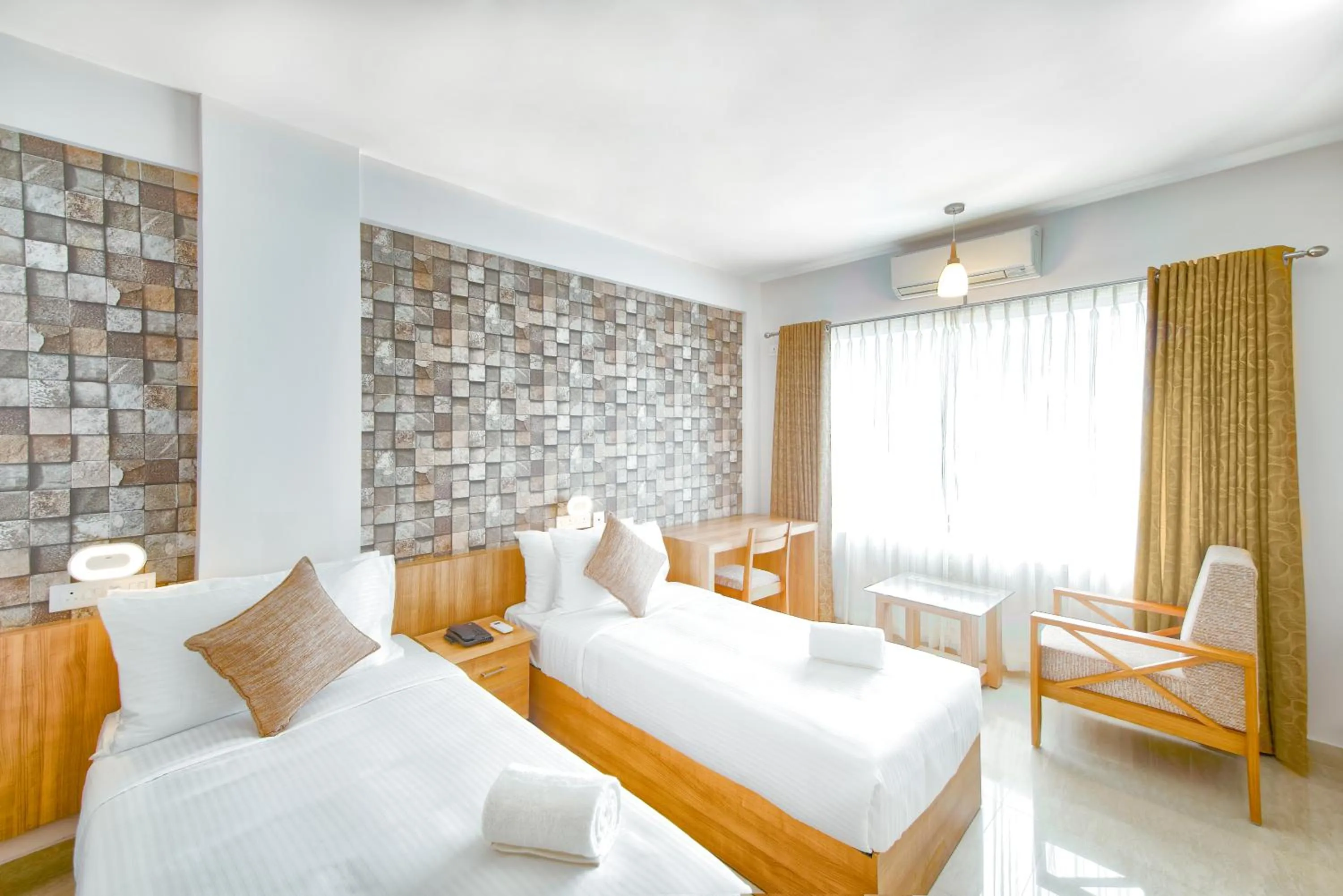 Bed in Sidra Pristine Hotel and Portico Halls