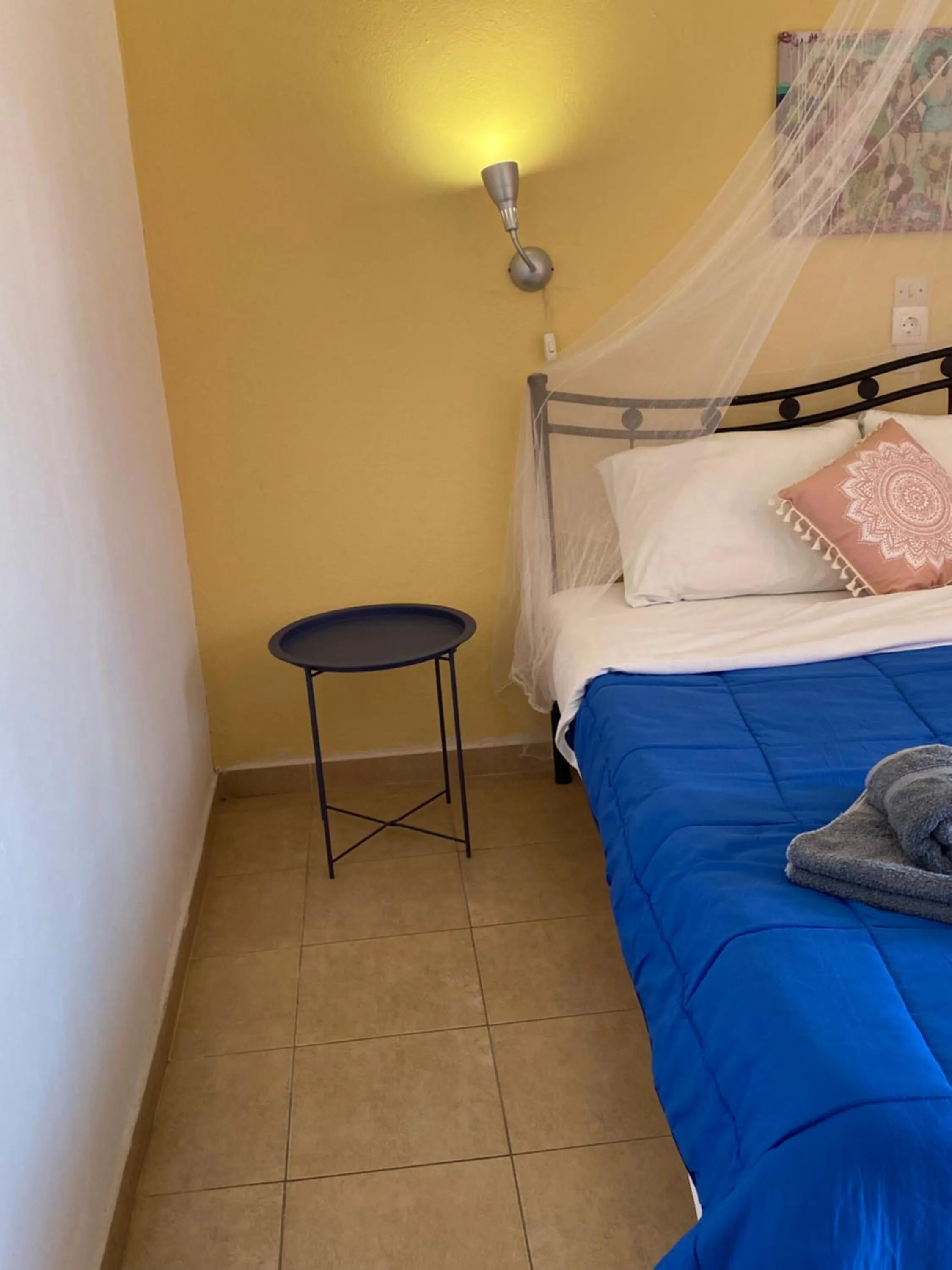 Bed in Avra Budget Beach Rooms