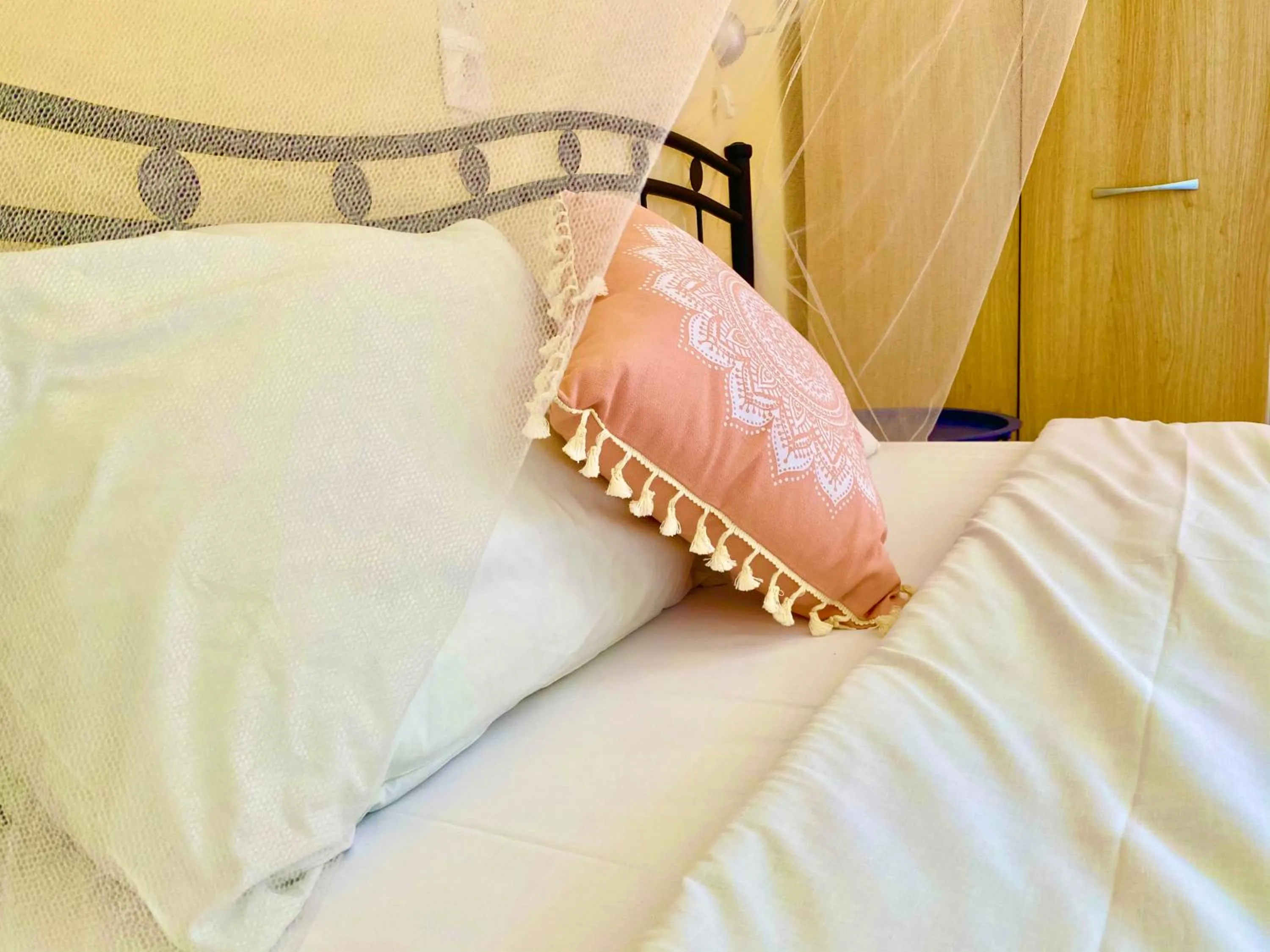 Bed in Avra Budget Beach Rooms