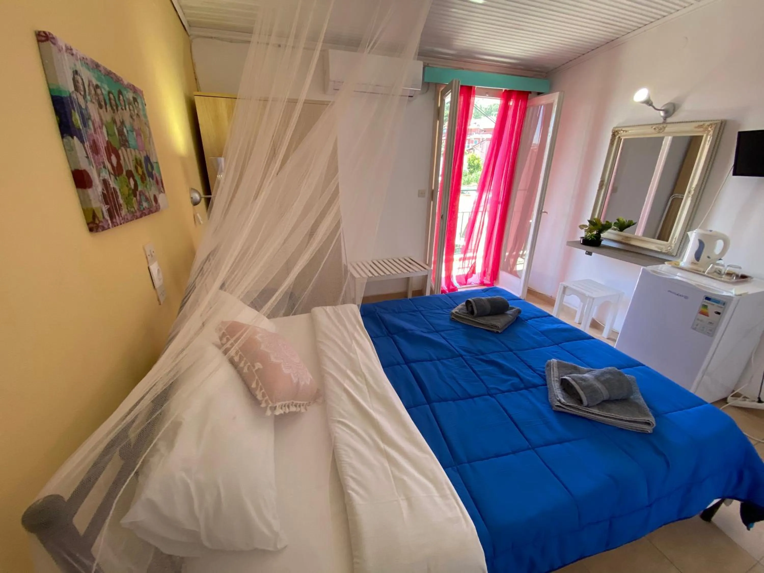 Bed in Avra Budget Beach Rooms