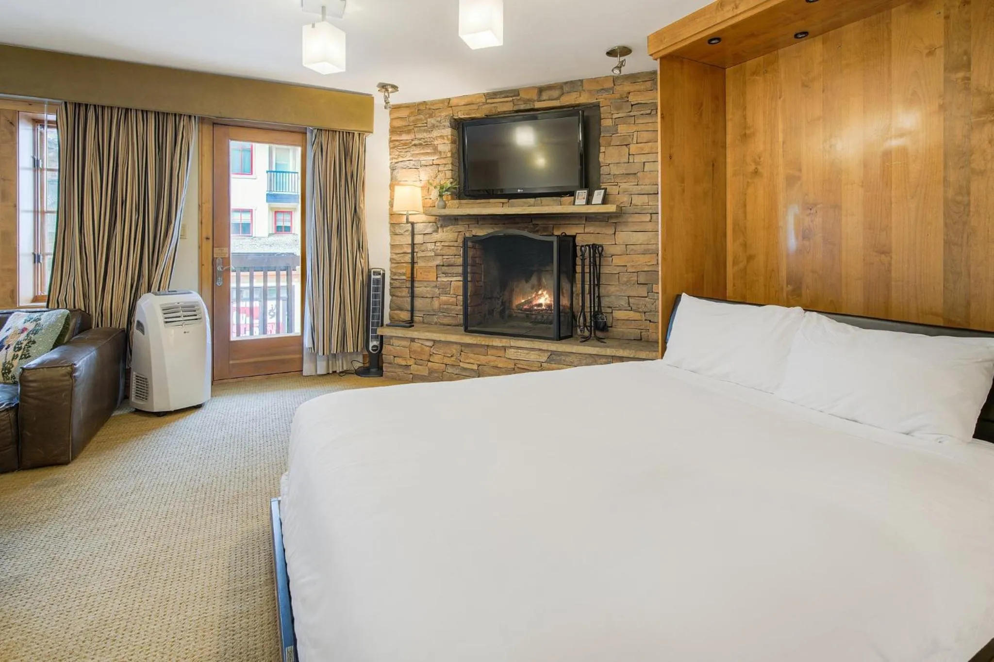 Living room, Bed in Lodge at Vail, A RockResort by Vail Resorts