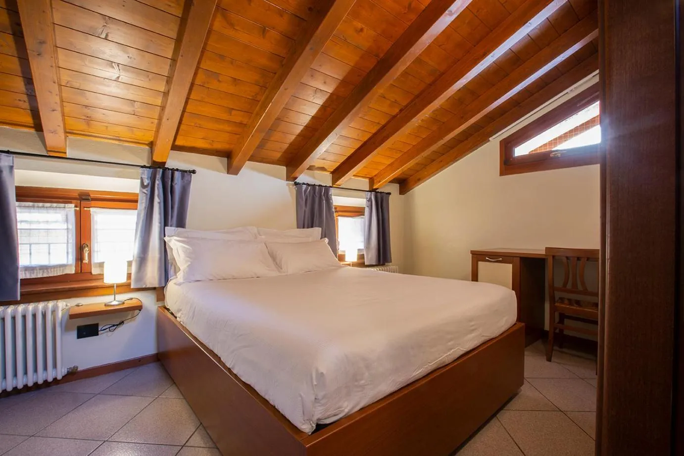 Bed in Antico Pozzo Apartment