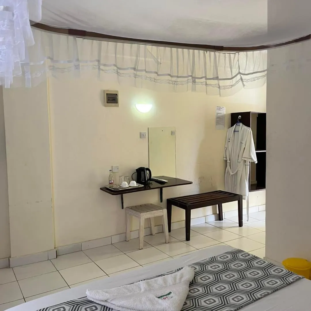 Bed in Merry Villa Hotel & Apartments