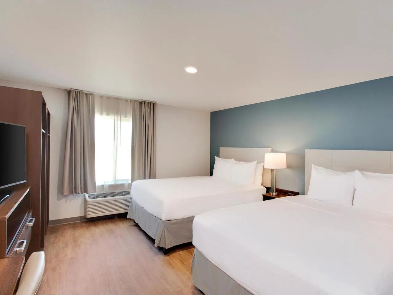 Bedroom, Bed in WoodSpring Suites Plano - North Dallas