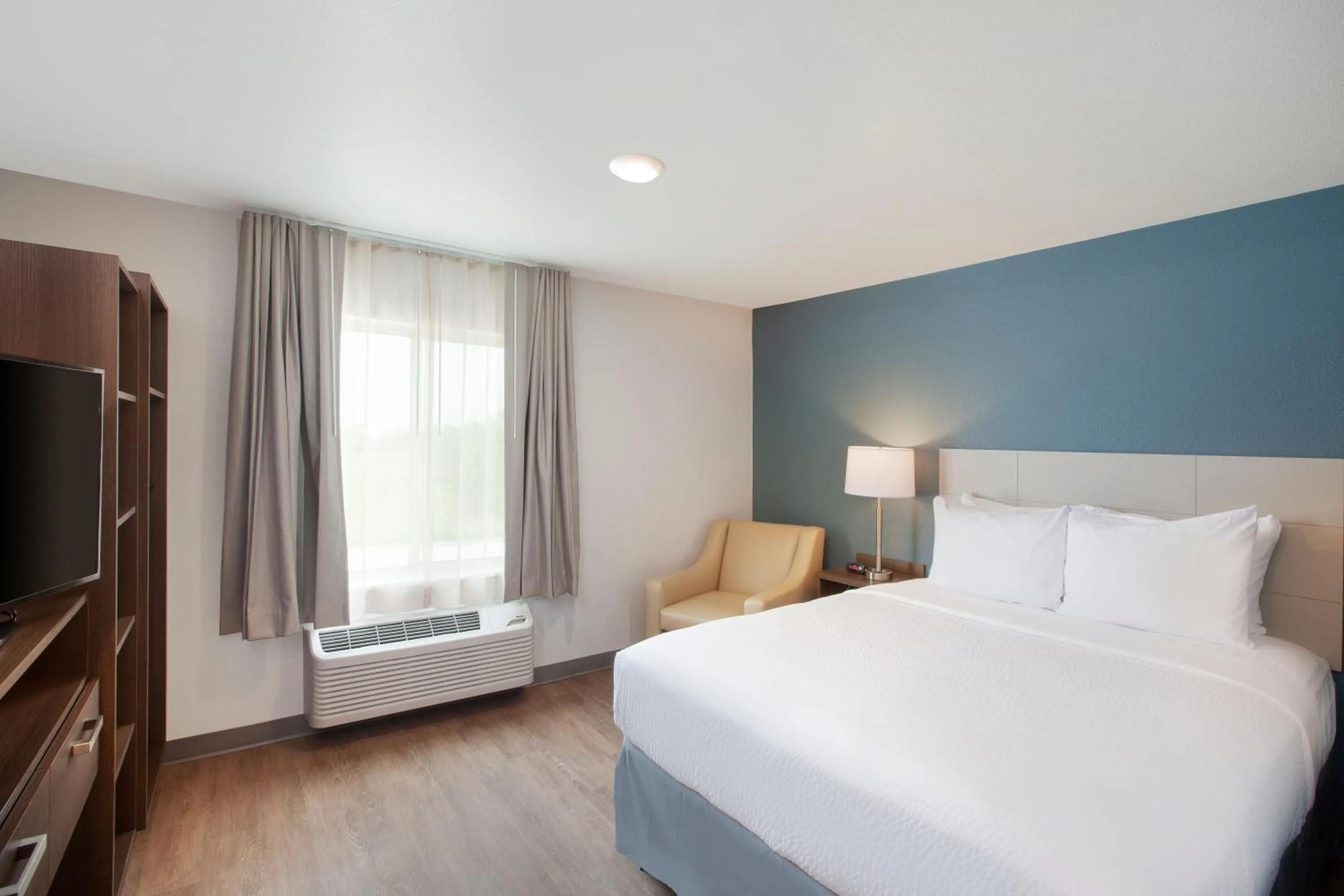 Bedroom, Bed in WoodSpring Suites Plano - North Dallas