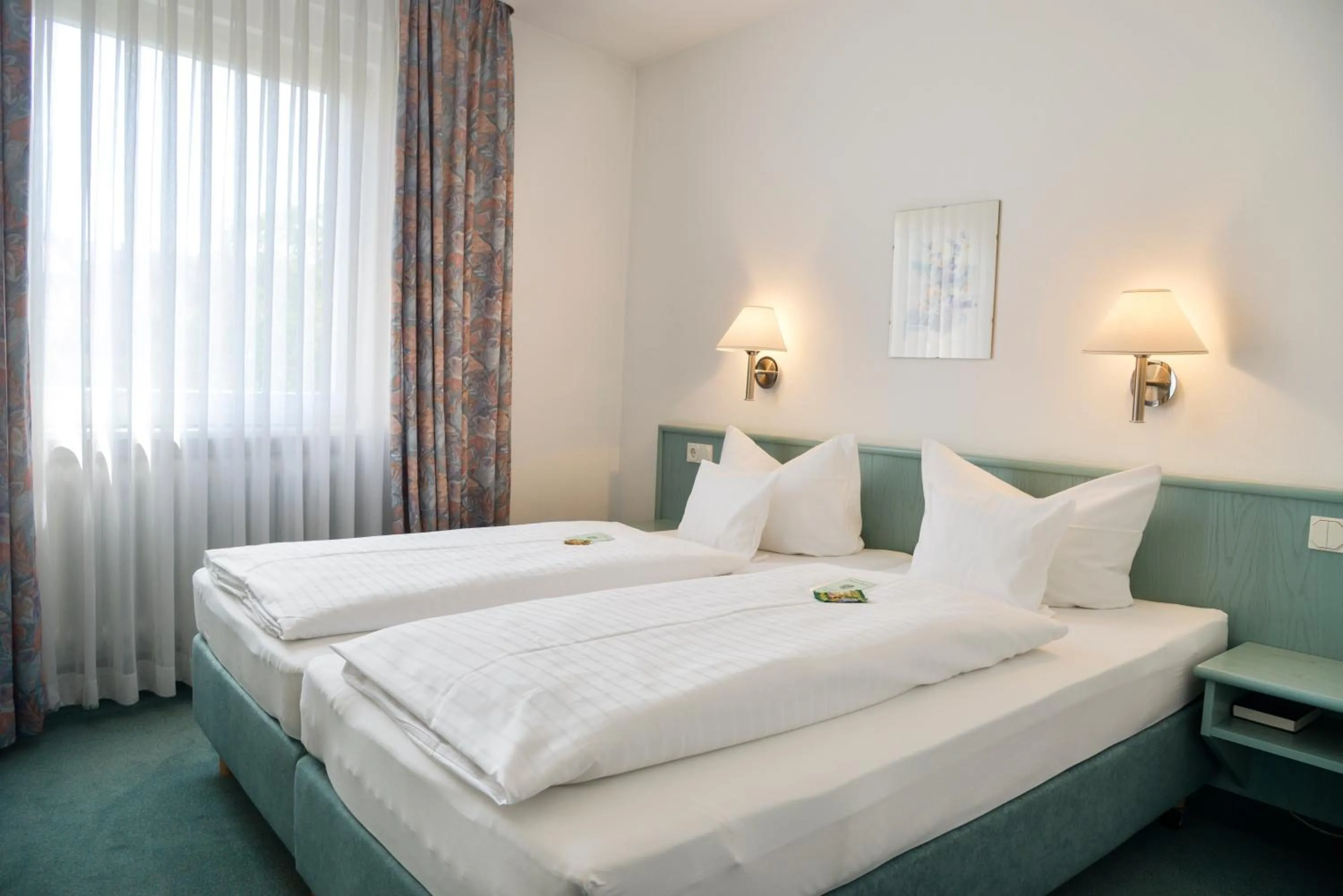Bed in Hotel Till Eulenspiegel - Nichtrauchhotel - Garni