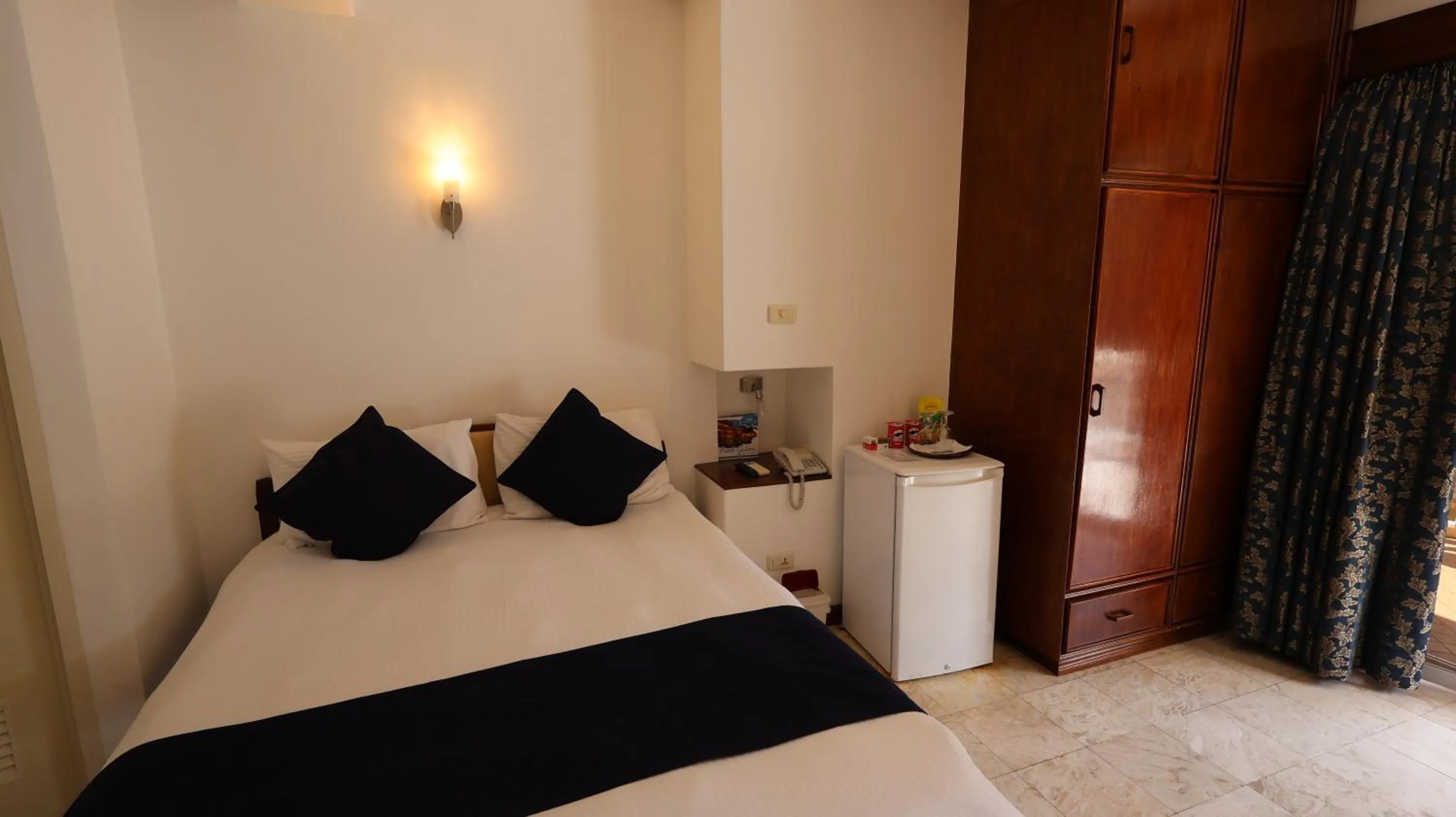 Bed in Mermaid Resort and Dive Center