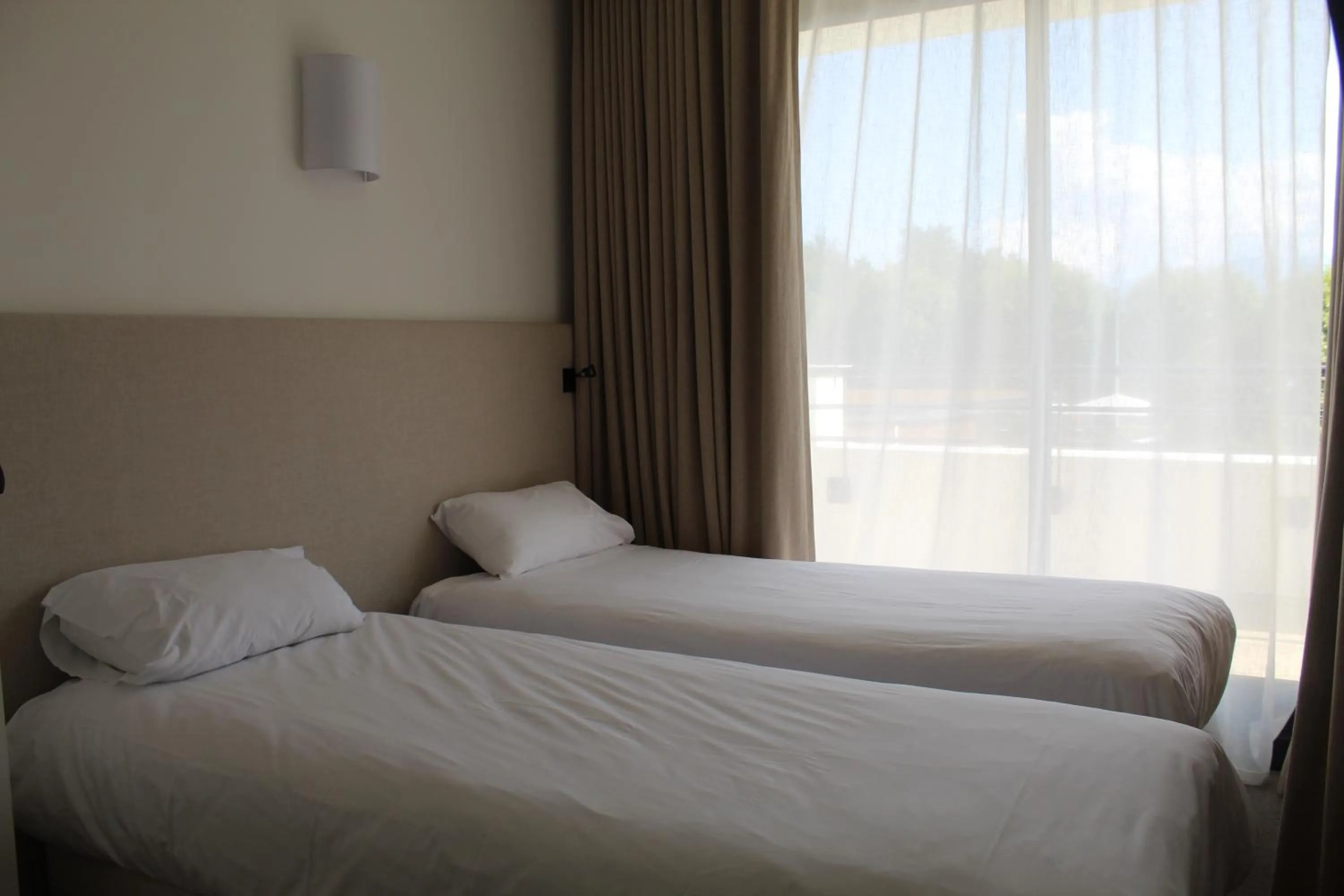 Bed in Hôtel Les Muses