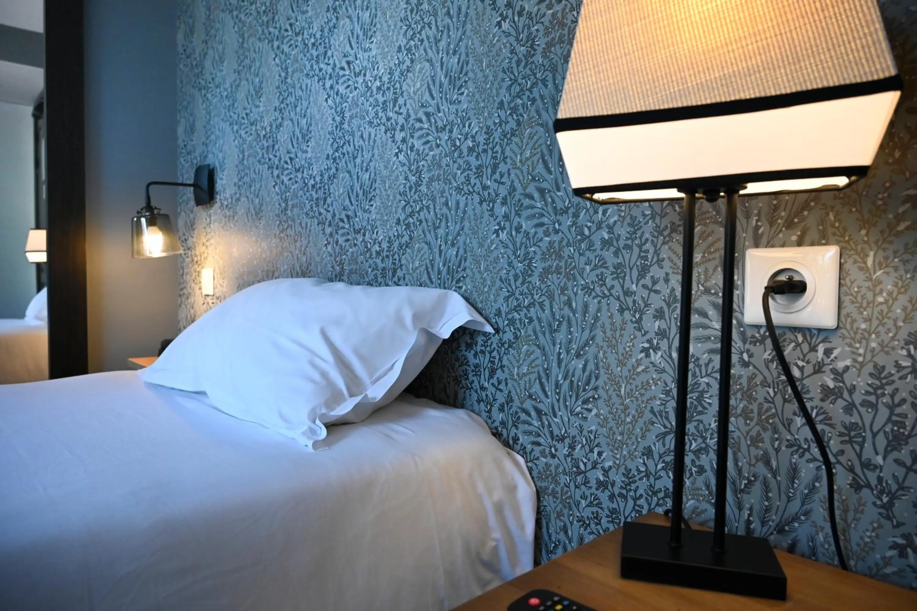 Bed in Hôtel Les Muses