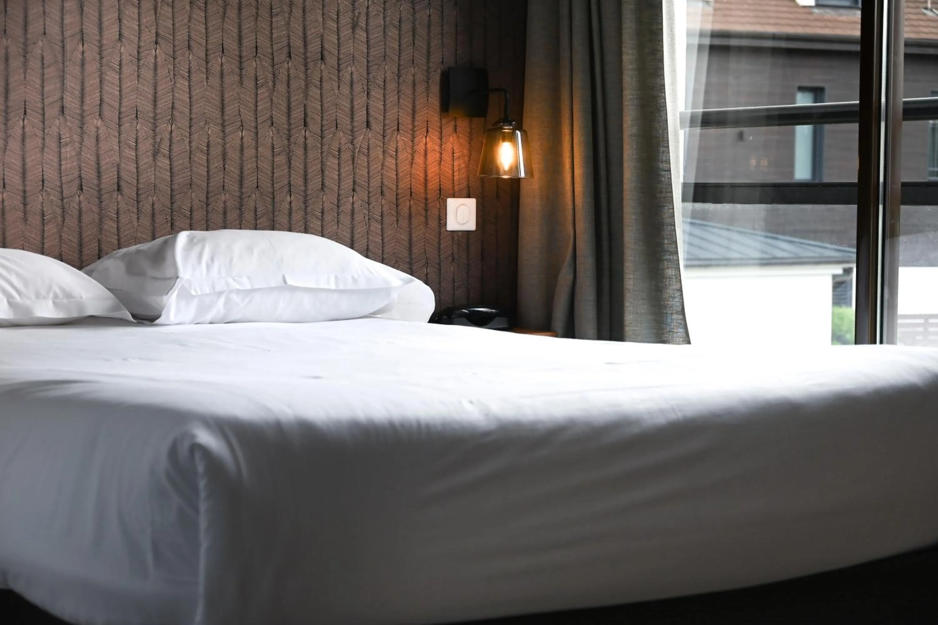 Bed in Hôtel Les Muses