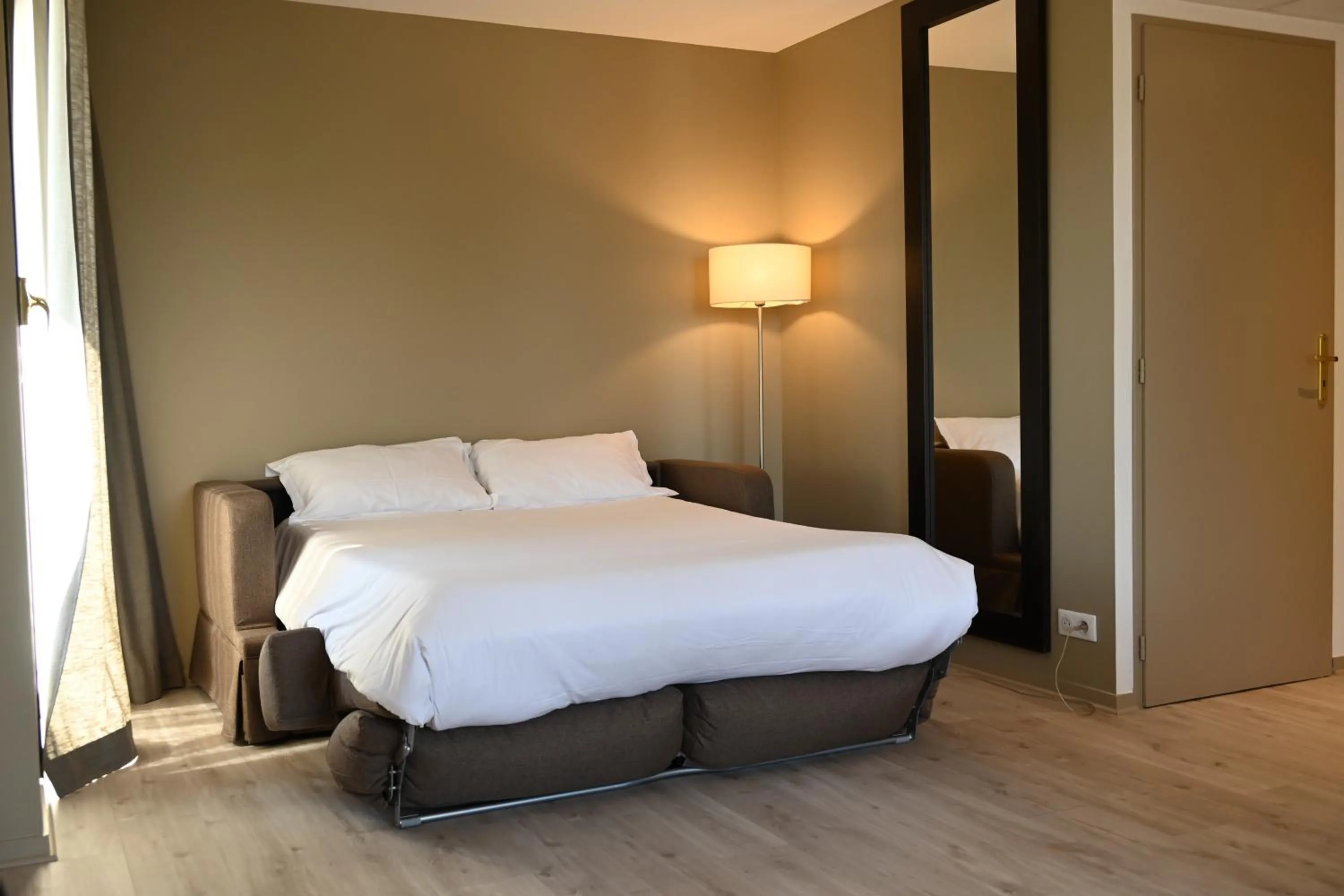 Bed in Hôtel Les Muses