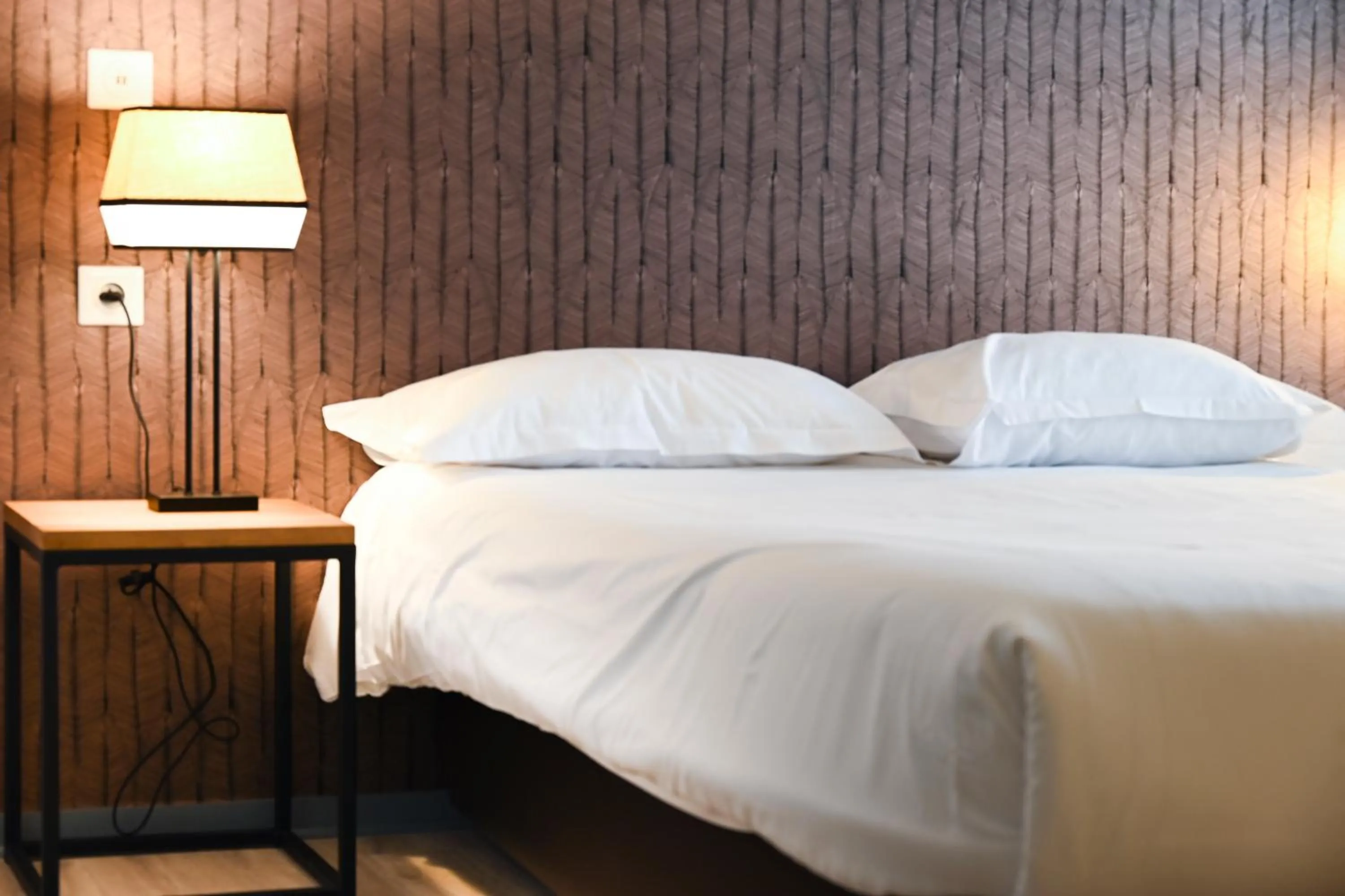 Bed in Hôtel Les Muses