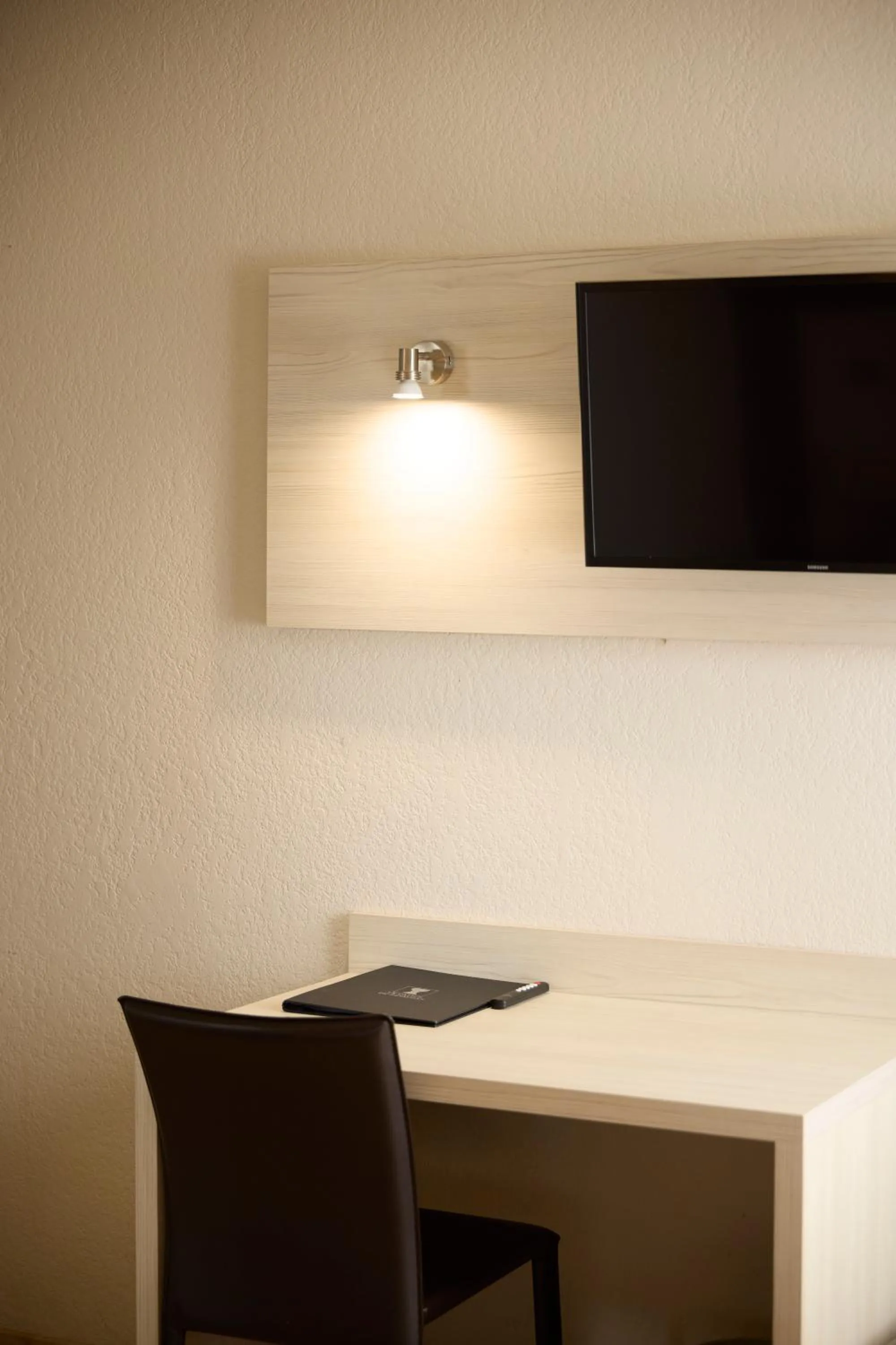 Bedroom in Hôtel-Restaurant Le Calice Du Gevaudan - A75