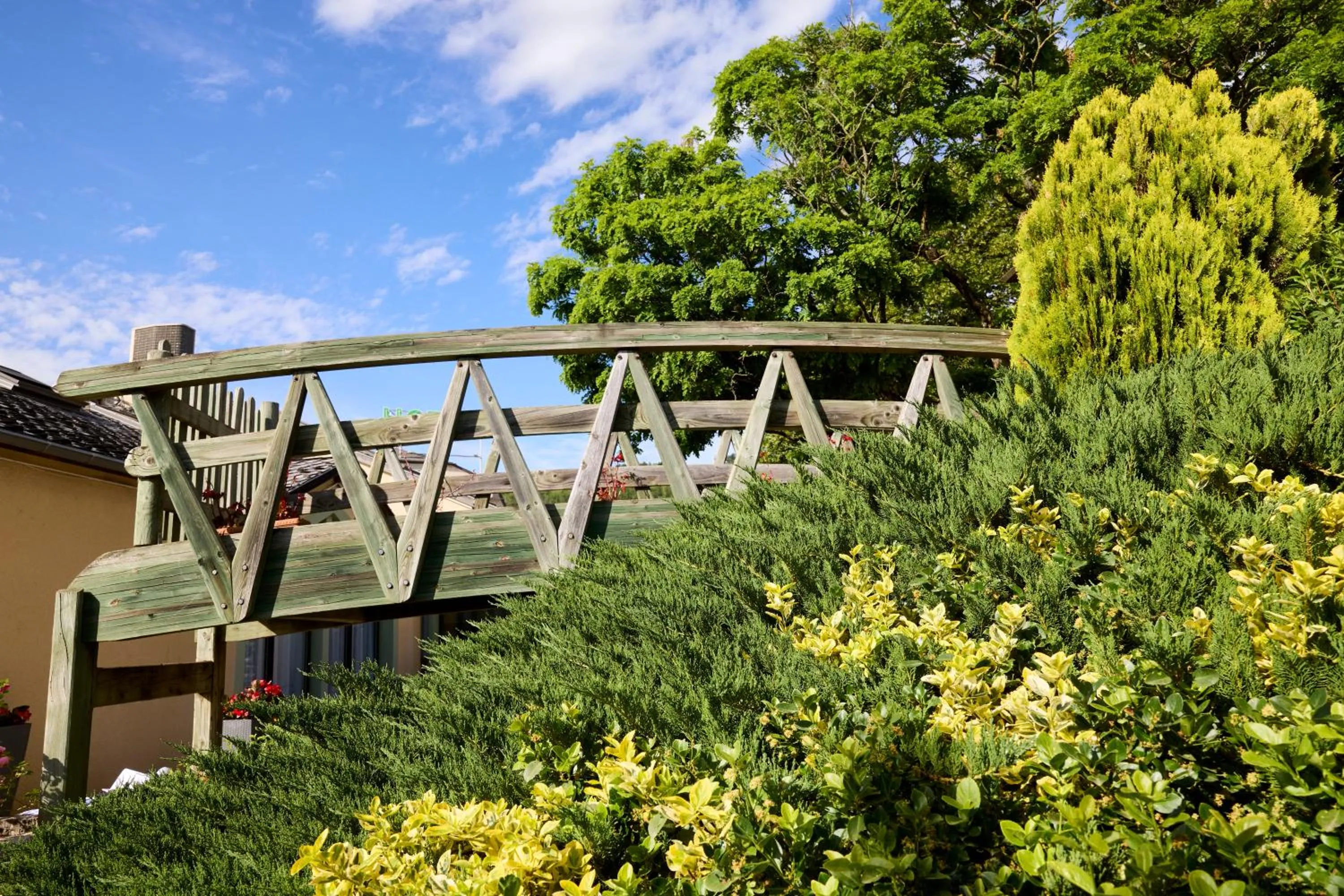 Garden view in Hôtel-Restaurant Le Calice Du Gevaudan - A75