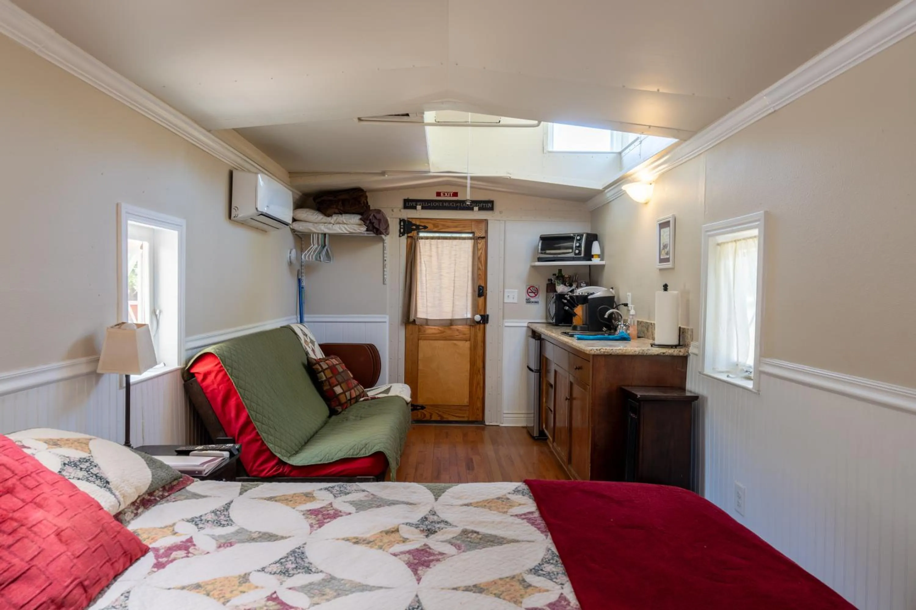 Seating area, Bed in Little Red Caboose