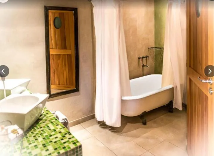 Bed in Lirolay Suites - Apart Hotel