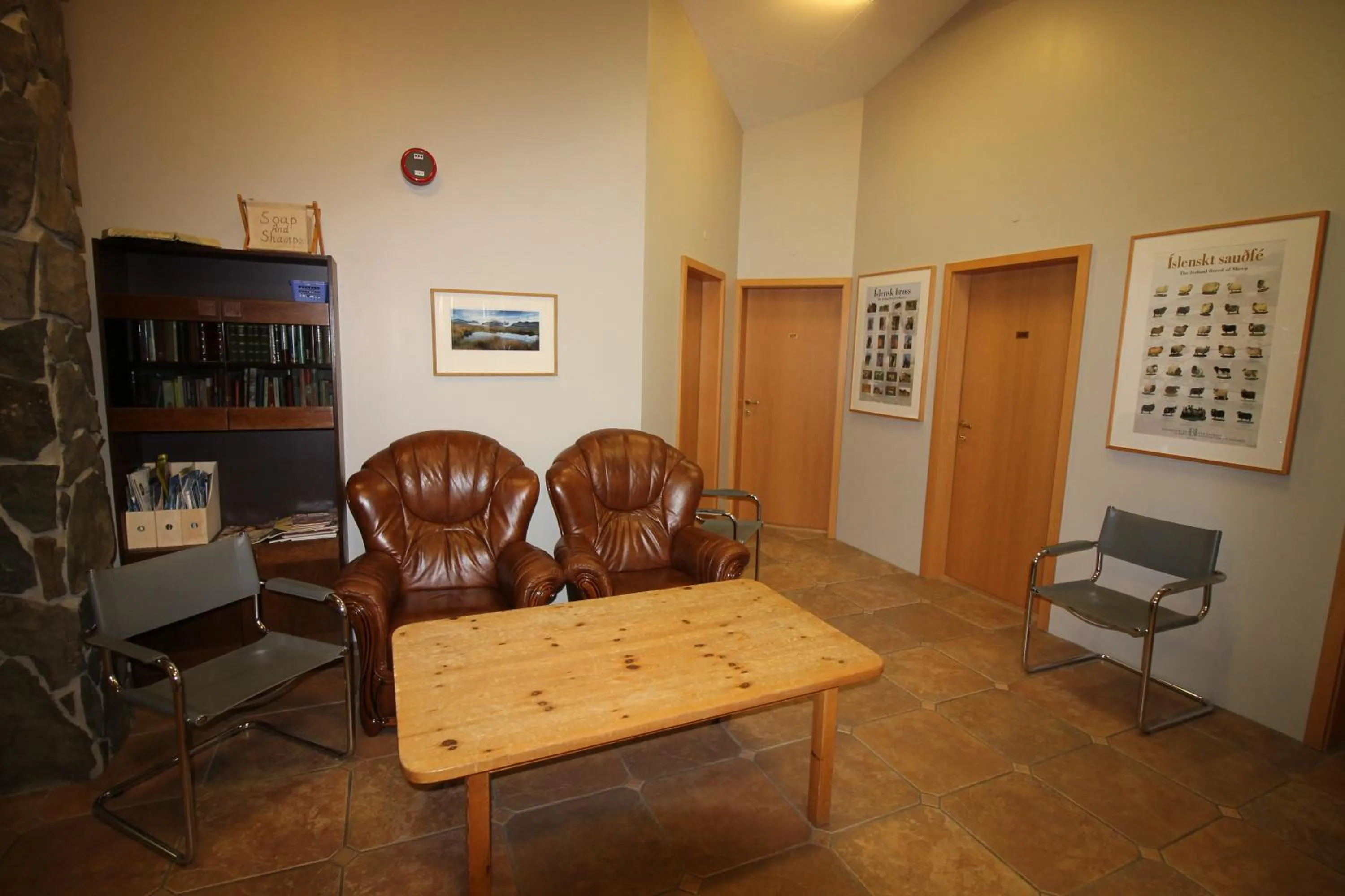 Communal lounge/ TV room in Hvoll Hostel