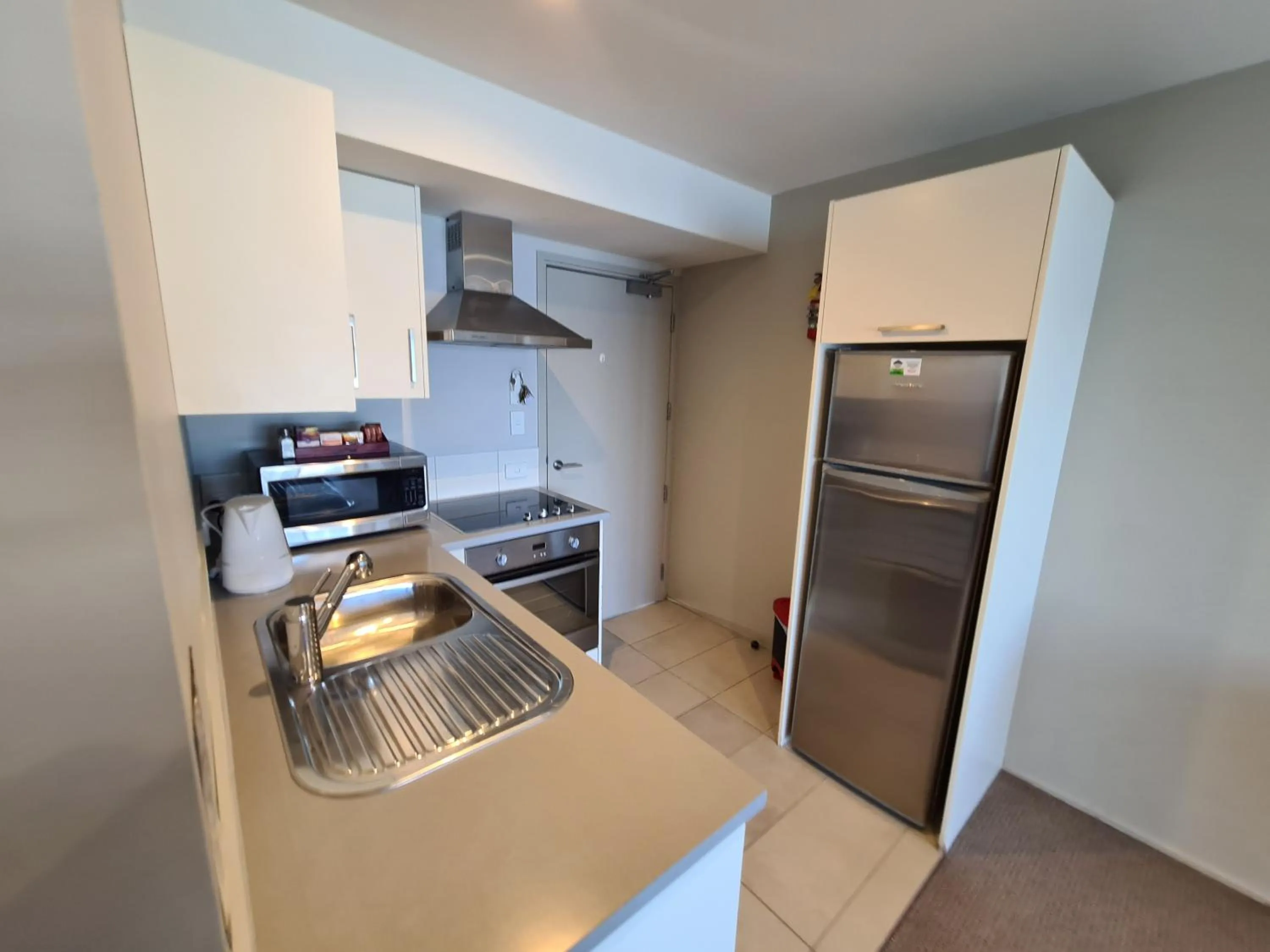 Kitchen or kitchenette in Te Kaha Beach Hotel