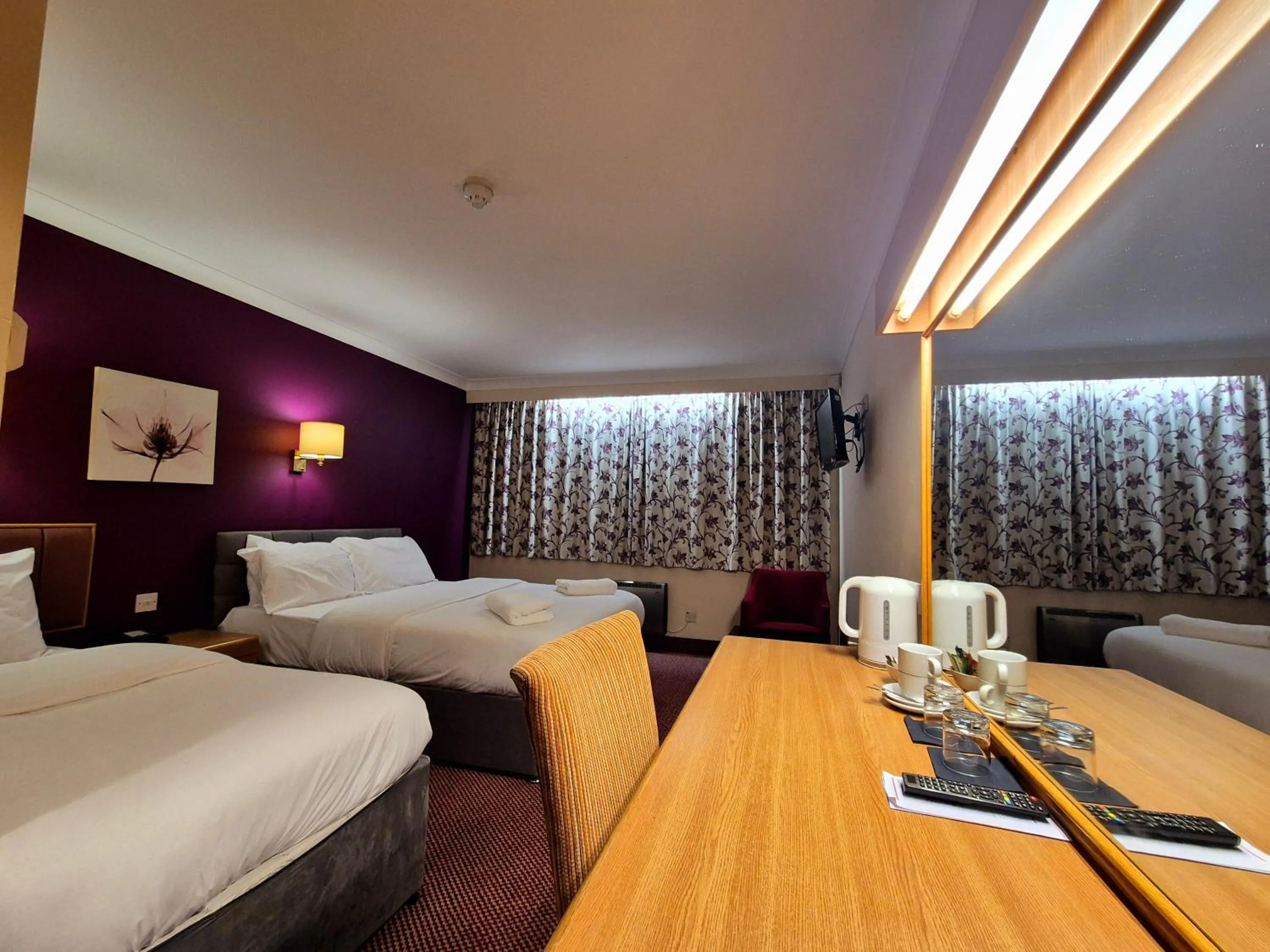 Bed in Supreme Inn Boston