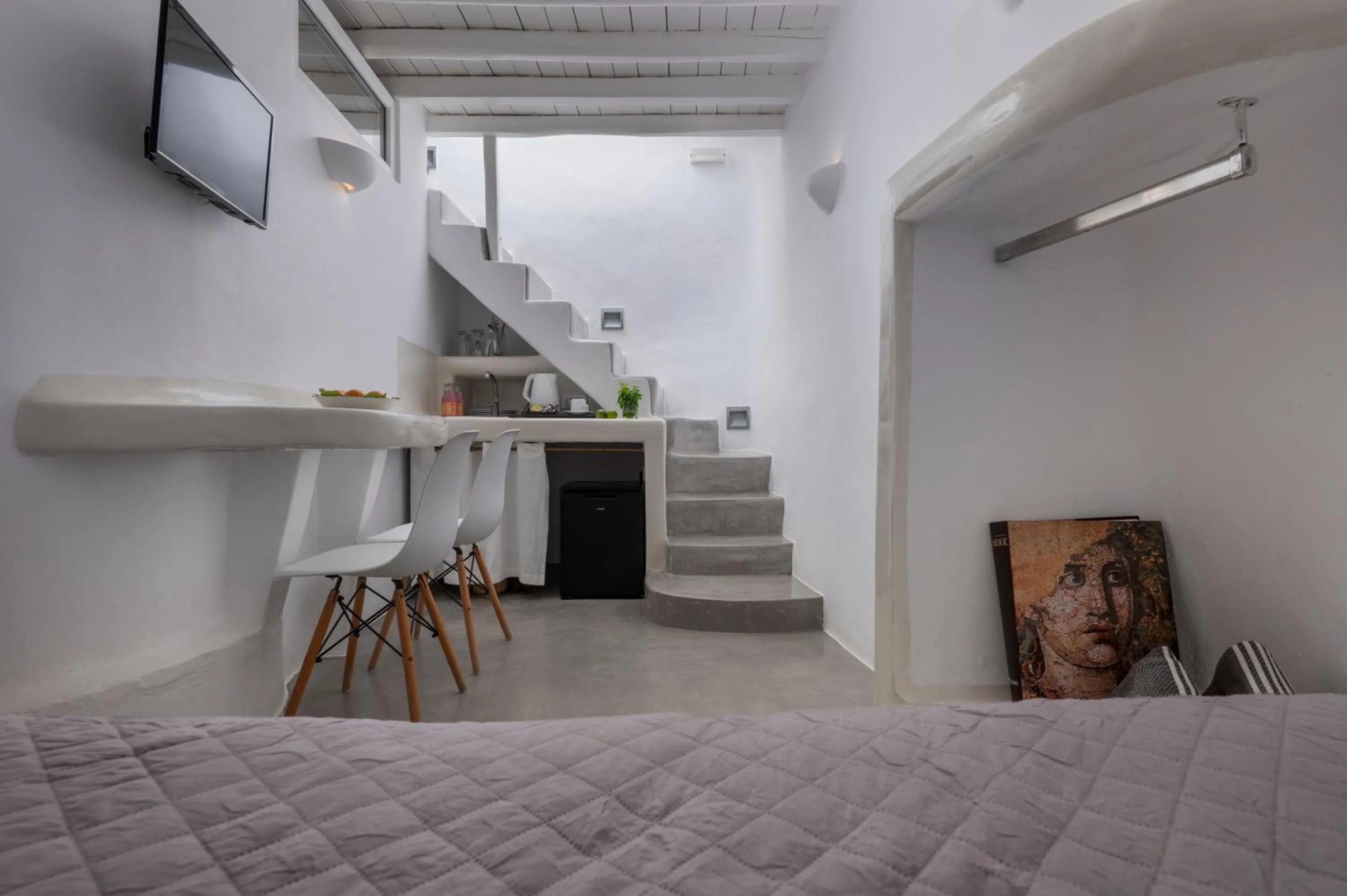 Bed in Flaskos Luxury Suites