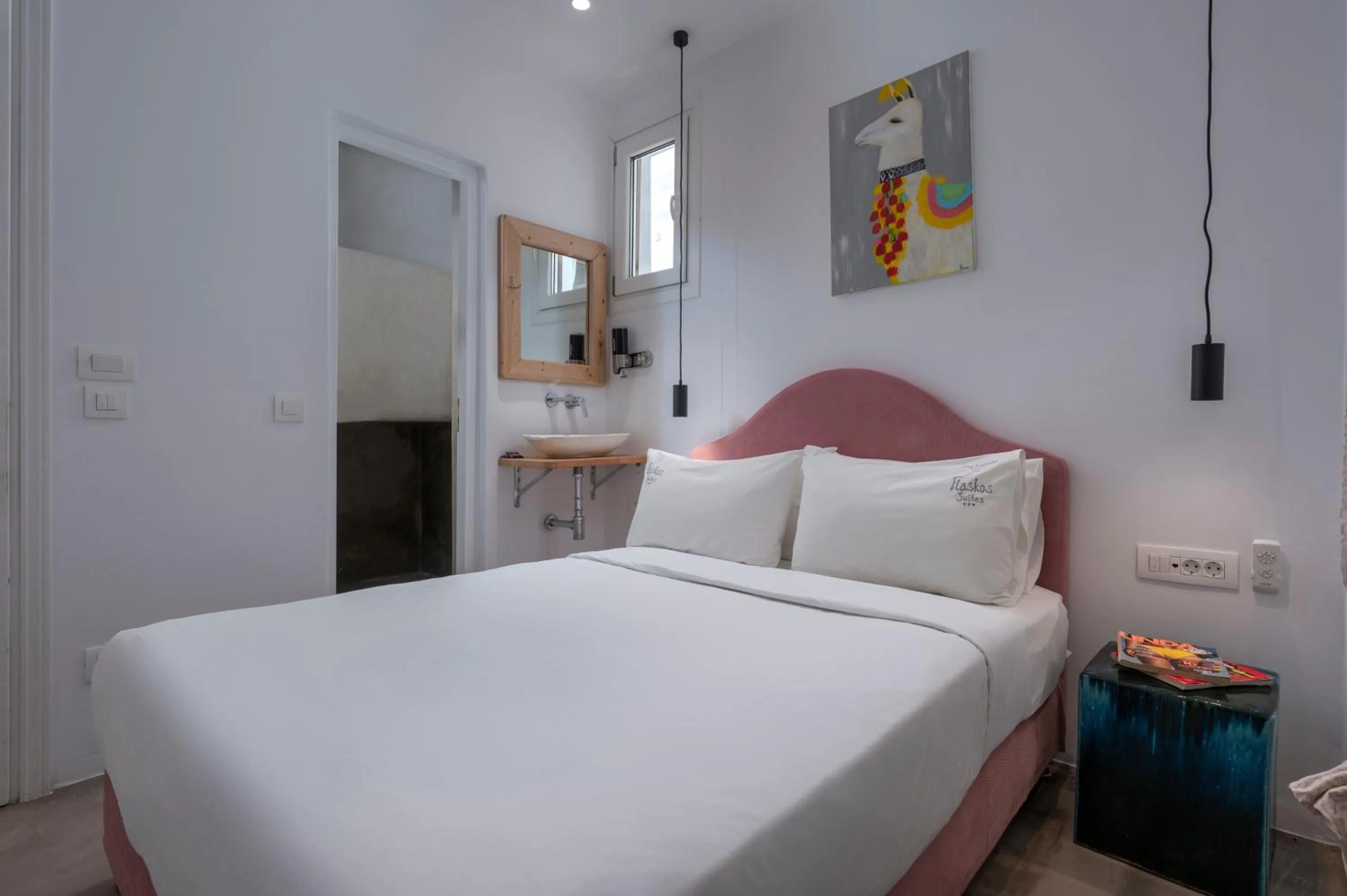 Bed in Flaskos Luxury Suites