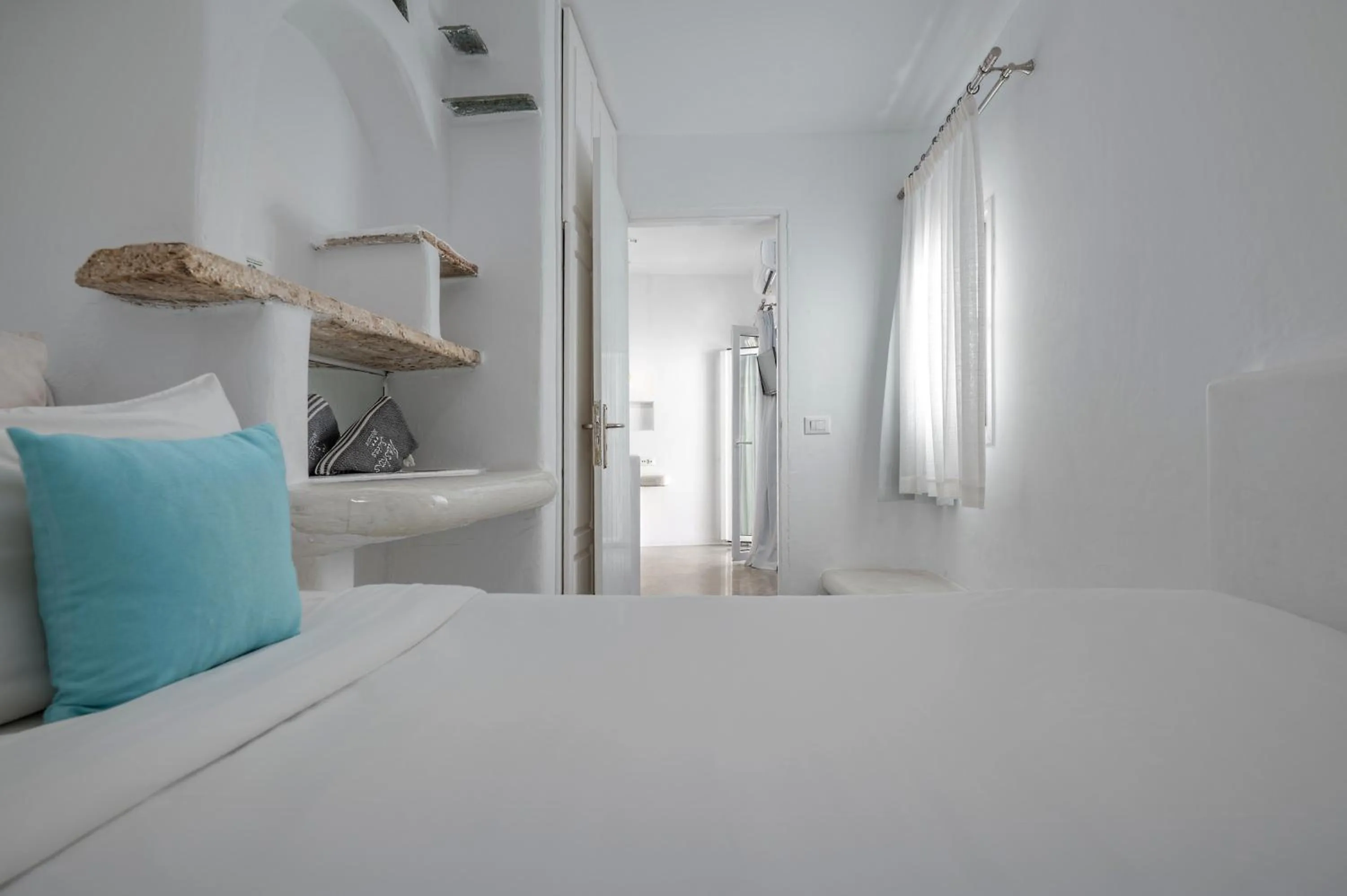 Bed in Flaskos Luxury Suites