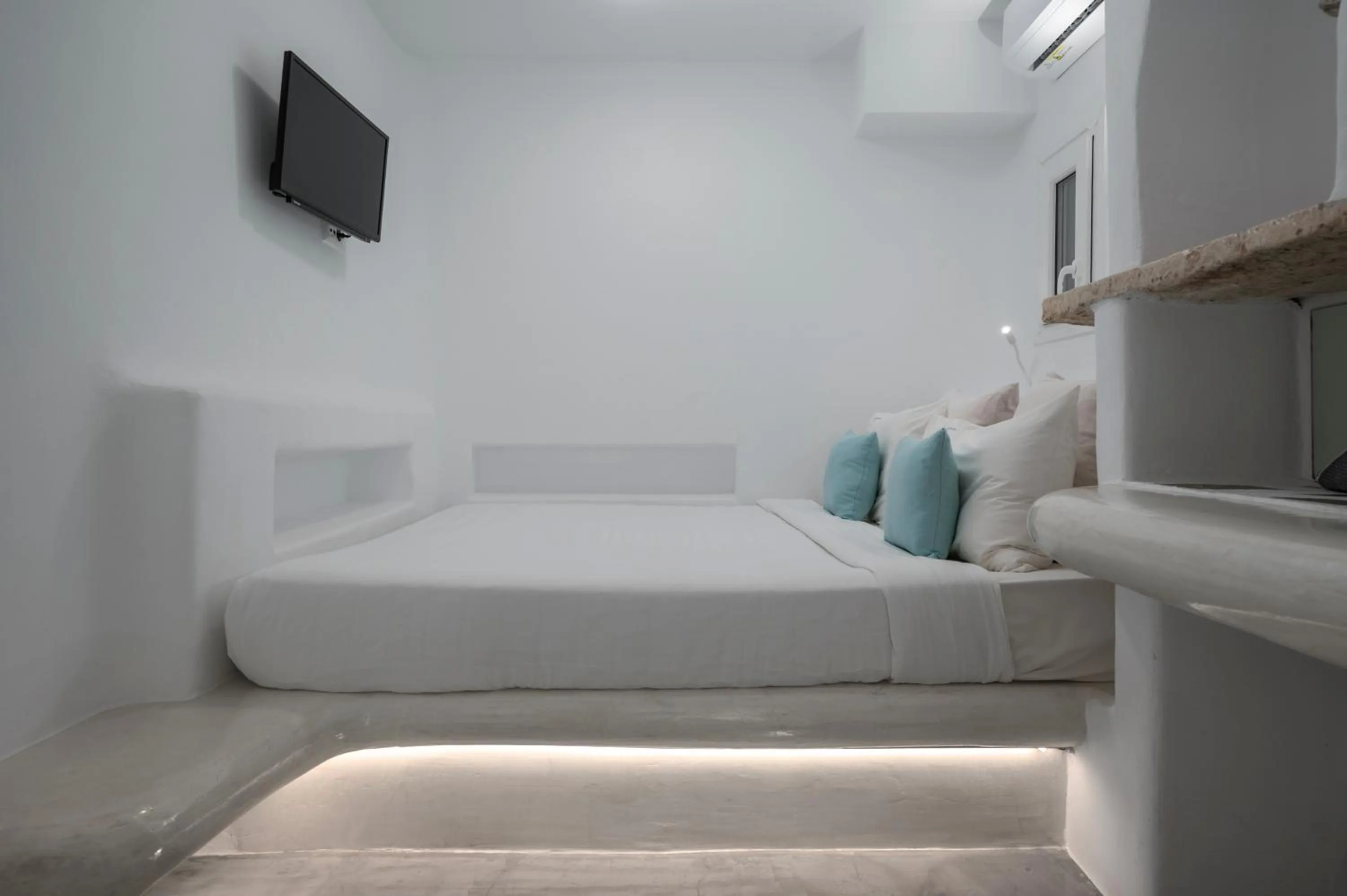 Bed in Flaskos Luxury Suites