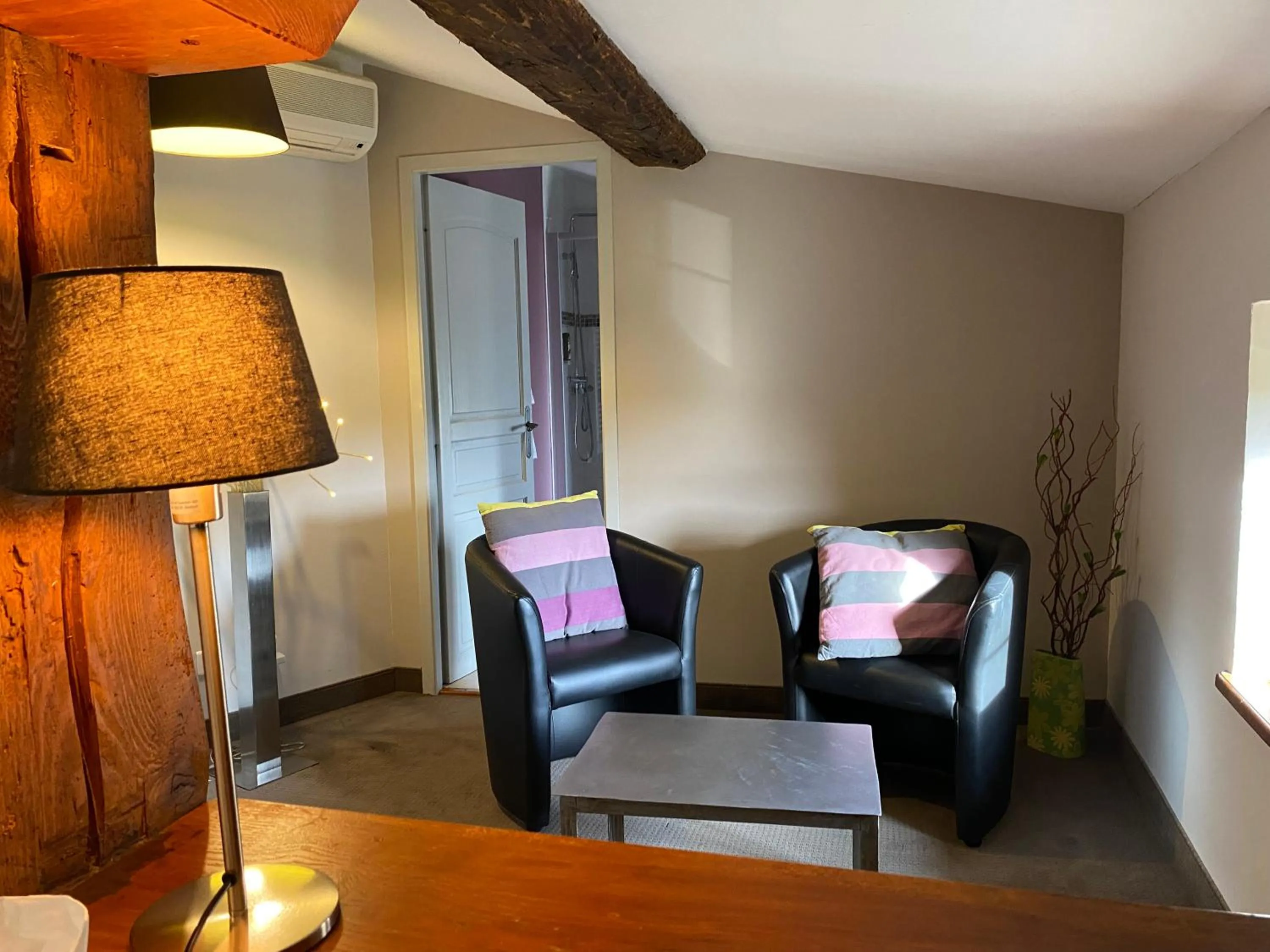 Seating area in Logis Hôtel Château De Palaja