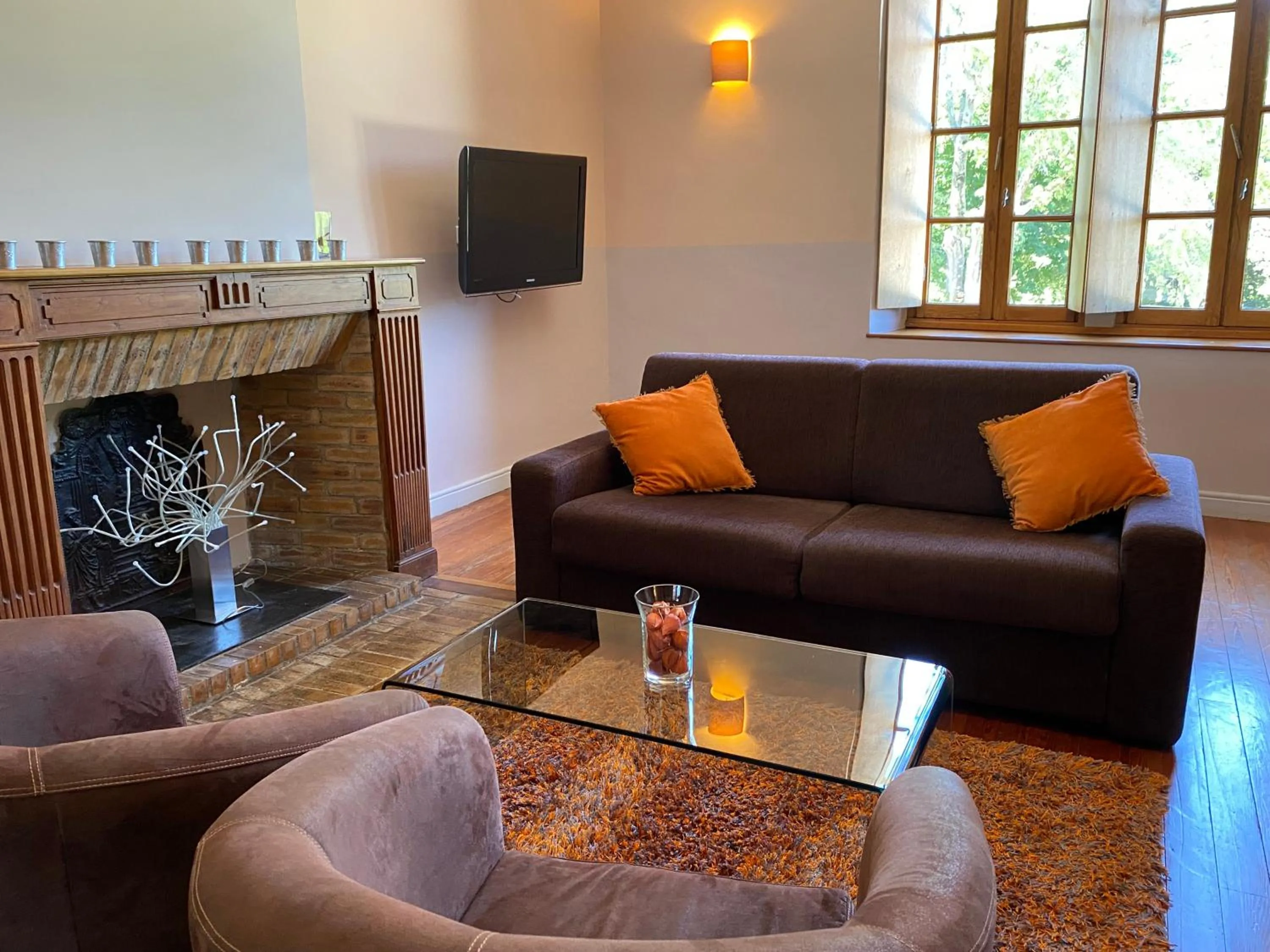 Seating area in Logis Hôtel Château De Palaja