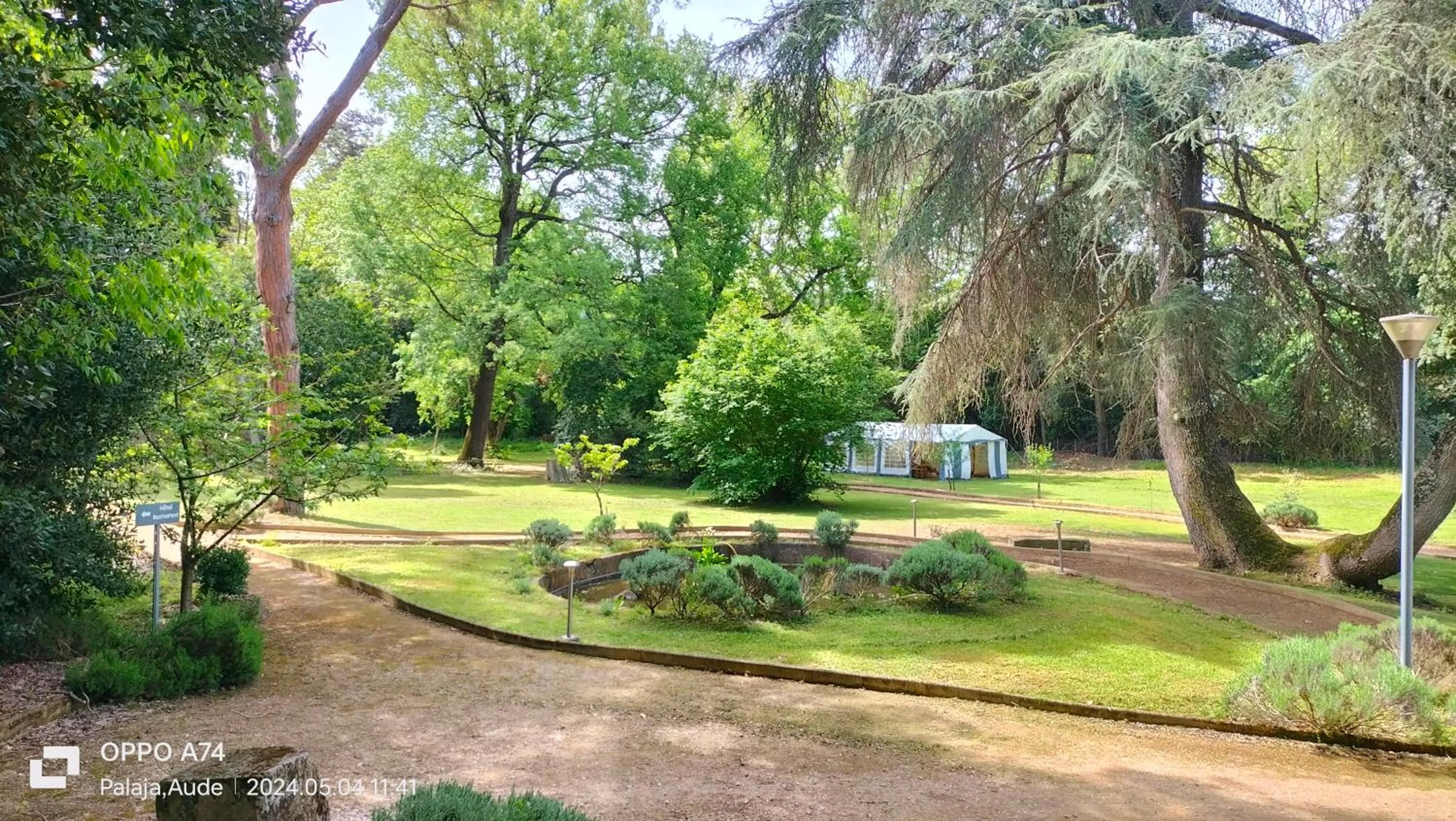 Garden in Logis Hôtel Château De Palaja
