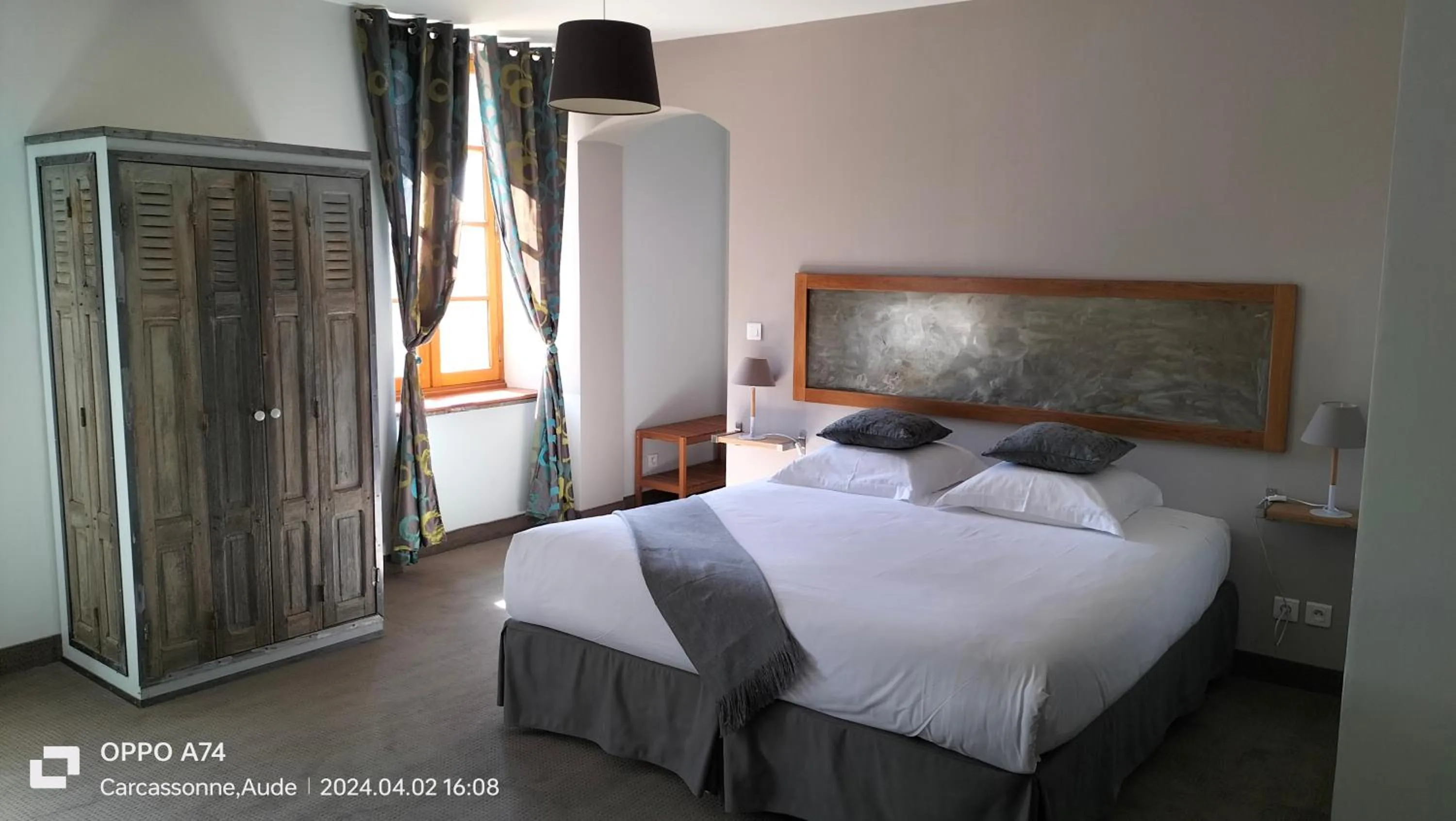 Bed in Logis Hôtel Château De Palaja