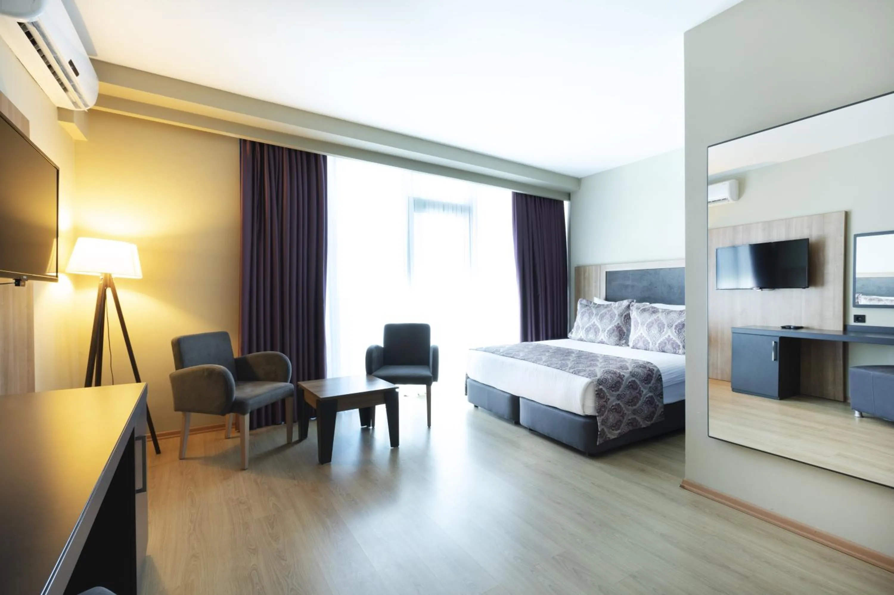 Photo of the whole room, Bed in Euphoria Apartments