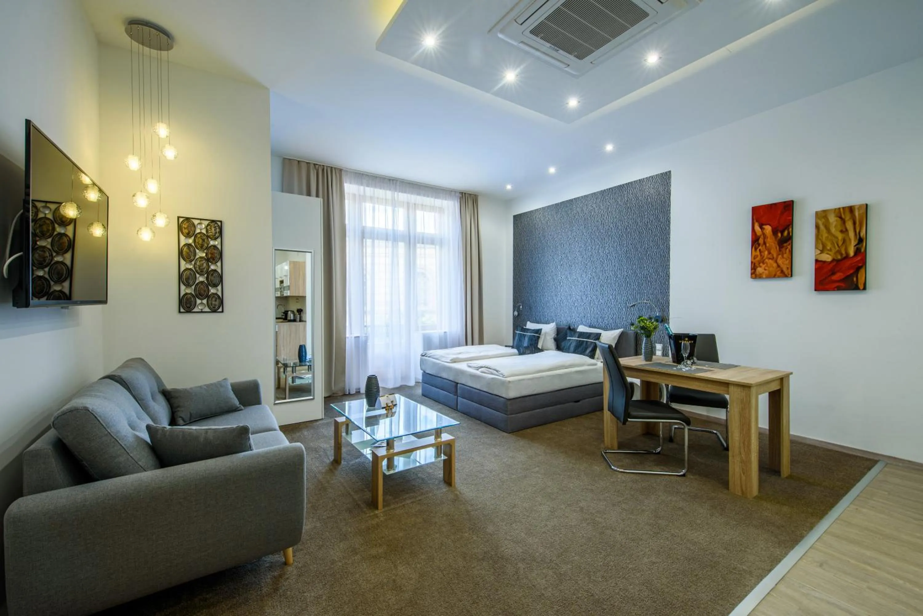 Living room, Bed in Karoly Corner Residences