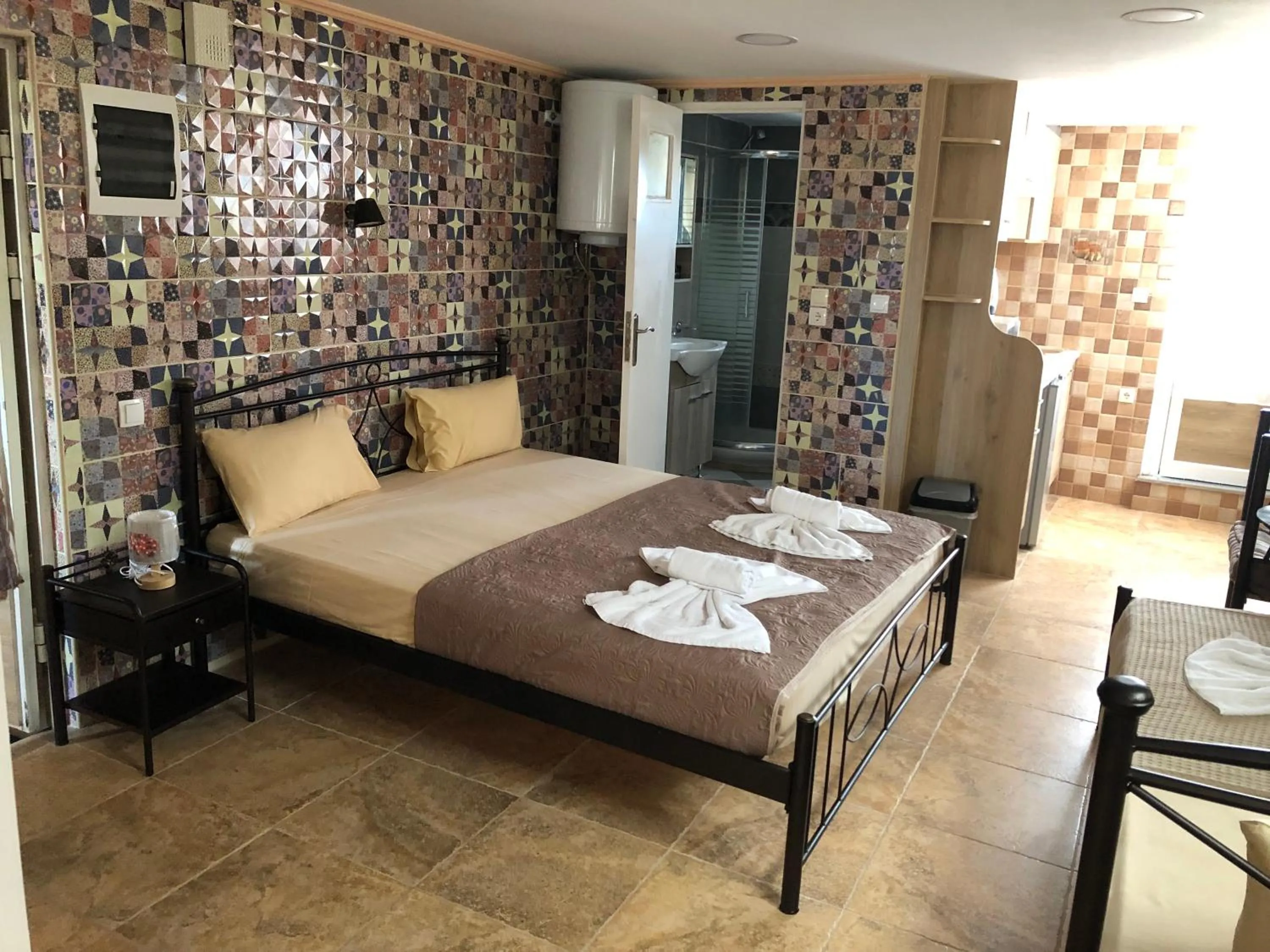 Bed in Nikolakakis Rooms Lavrio