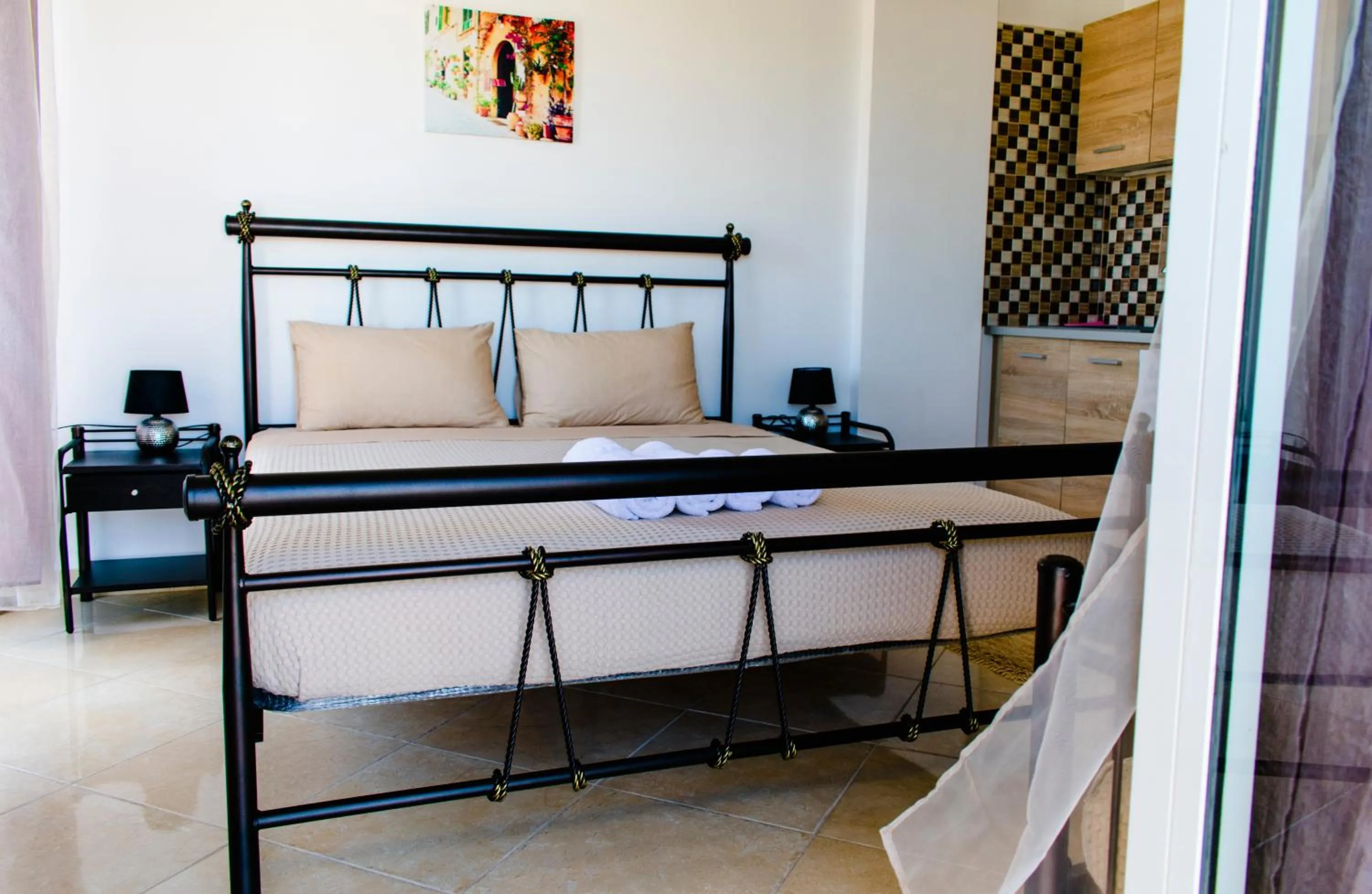 Bed in Nikolakakis Rooms Lavrio