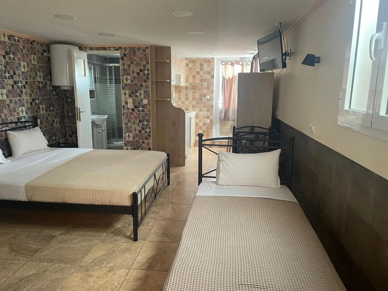 Bed in Nikolakakis Rooms Lavrio