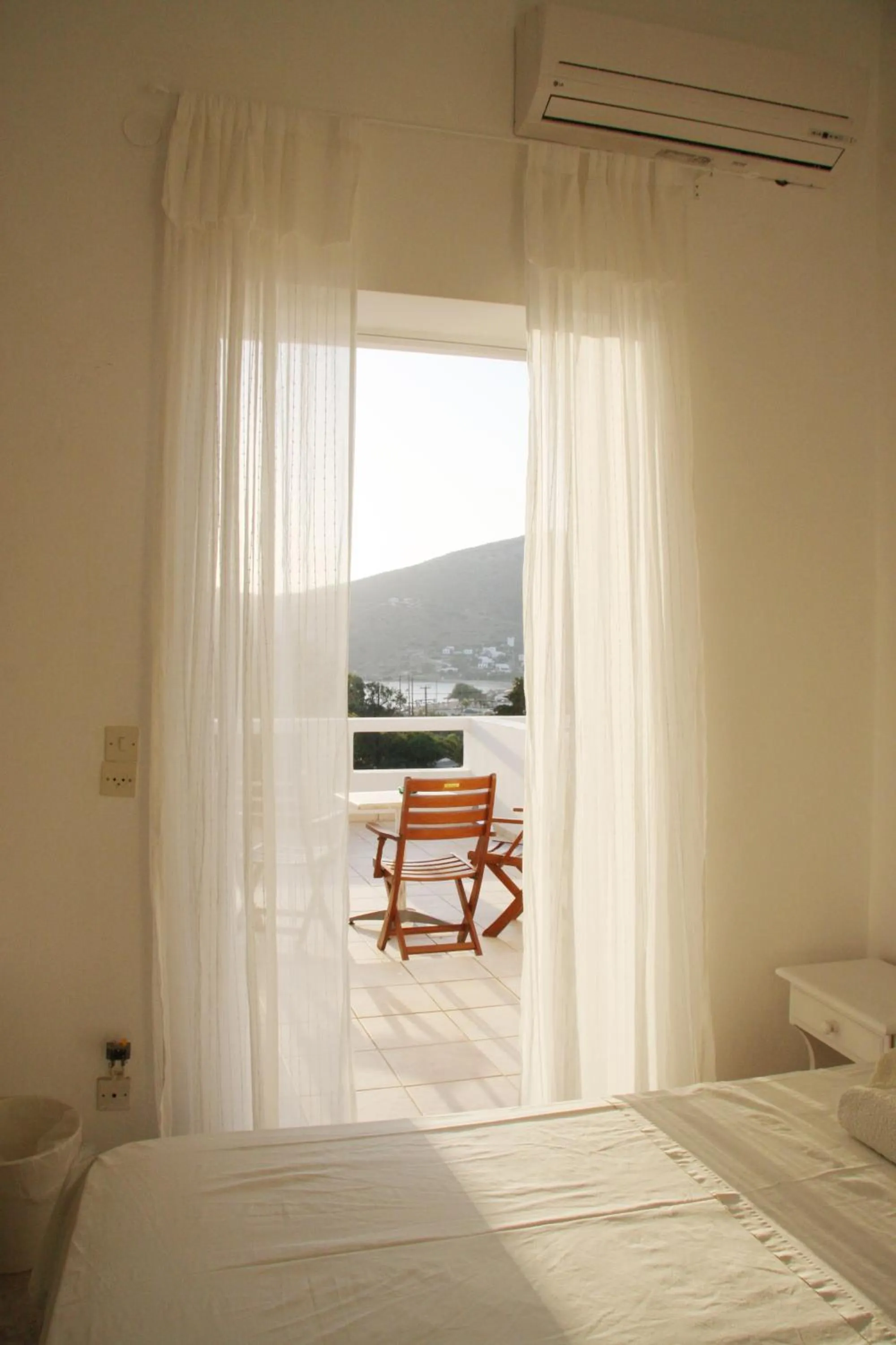 Balcony/Terrace, Bed in Armadoros Hotel / Ios Backpackers