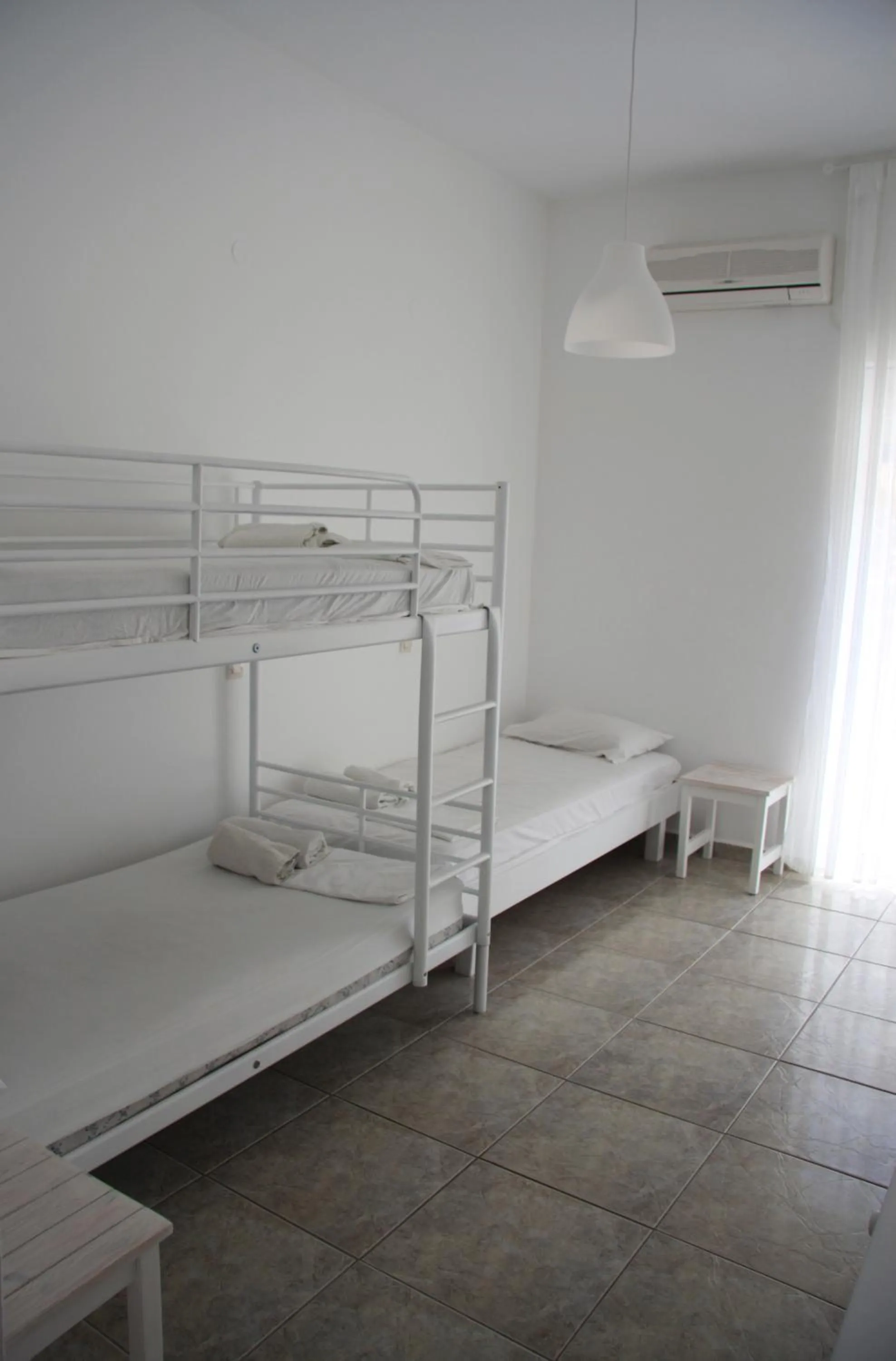 Photo of the whole room, Bed in Armadoros Hotel / Ios Backpackers