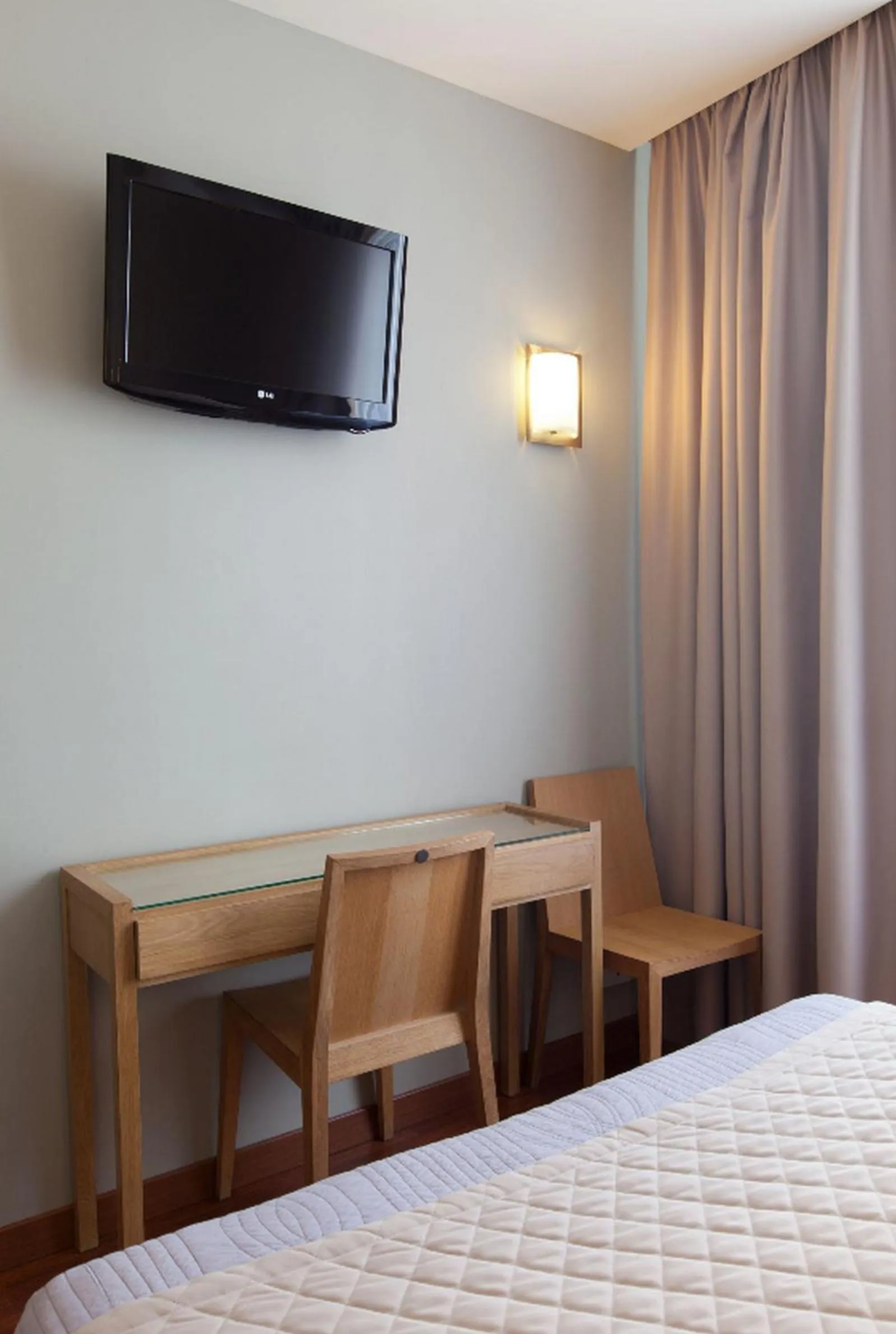 Bed in Cosmotel Hotel