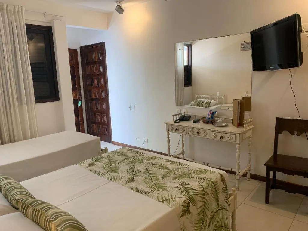 Photo of the whole room, Bed in Ubatuba Palace Hotel